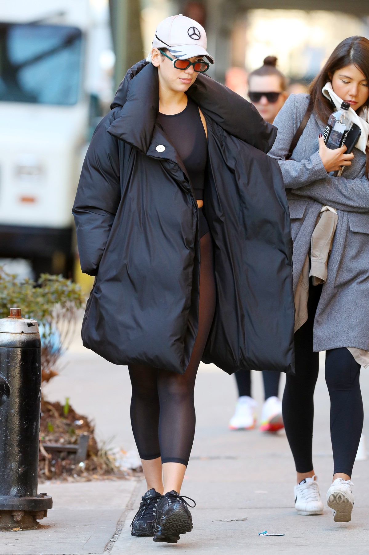 02/19/2020 Dua Lipa is pictured leaving a hot yoga class in New York City. The 24 year old English singer wore a Mercedes baseball cap, puffer jacket, semi-sheer athletic top, matching leggings, and sneakers., Image: 499649827, License: Rights-managed, Restrictions: NO usage without agreed price and terms. Please contact sales@theimagedirect.com, Model Release: no, Credit line: TheImageDirect.com / The Image Direct / Profimedia