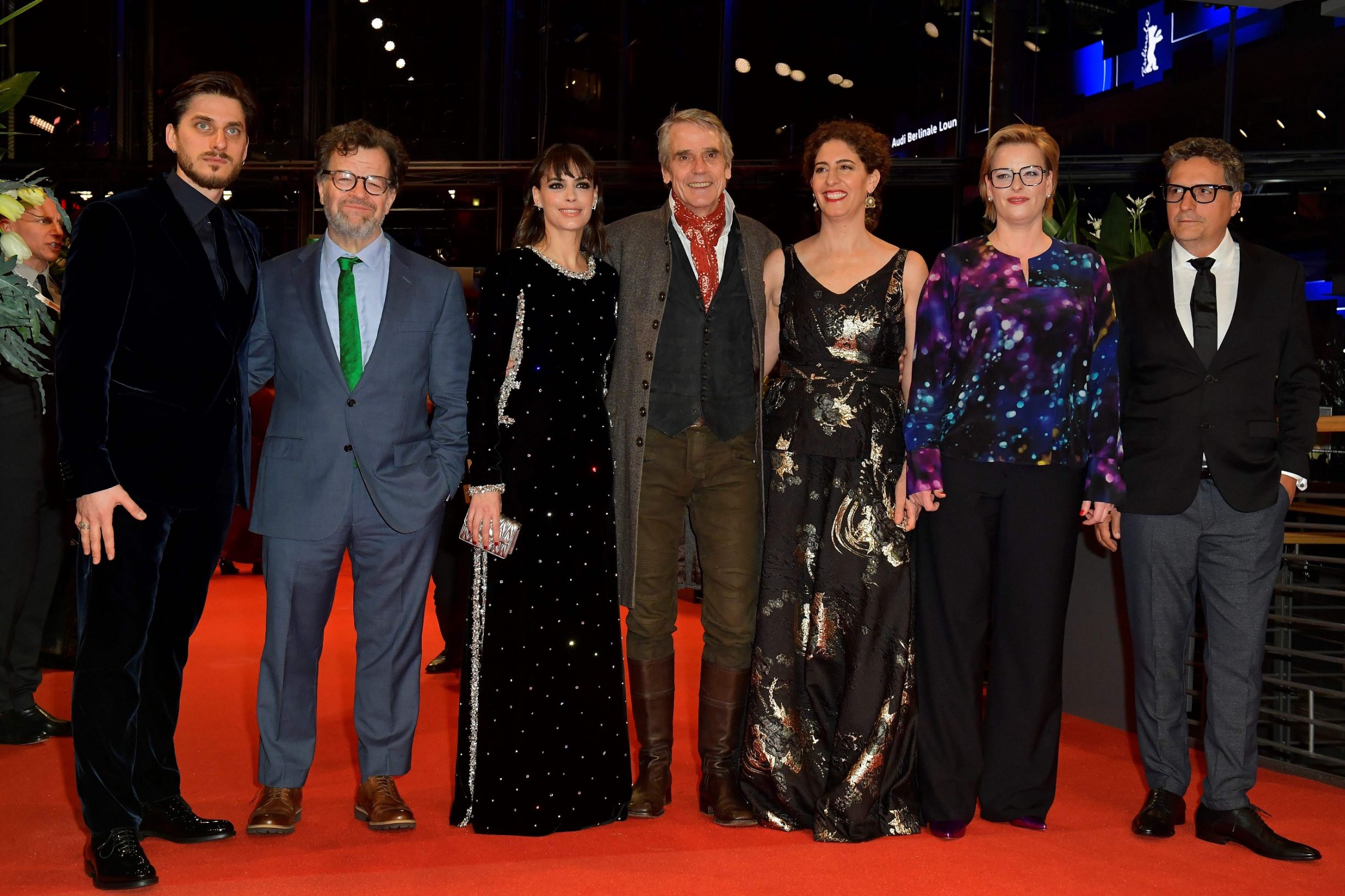 The Berlinale 2020 film festival International Jury German film producer Bettina Brokemper (2ndR), Italian actor Luca Marinelli (L), French-Argentinian actress Berenice Bejo (3rdL) Jury director British actor Jeremy Irons (C), US director Kenneth Lonergan (2ndL), Palestinian-US film director and writer Annemarie Jacir (3rdR) and Brazilian director Kleber Mendonca Filho (R) pose on the red carpet before the opening ceremony of the 70th Berlinale international film festival on February 20, 2020 in Berlin. - The 11-day Berlinale, one of Europe's most prestigious film extravaganzas alongside Cannes and Venice, celebrates its 70th anniversary in 2020 and runs until March 1, 2020. (Photo by Tobias SCHWARZ / AFP)