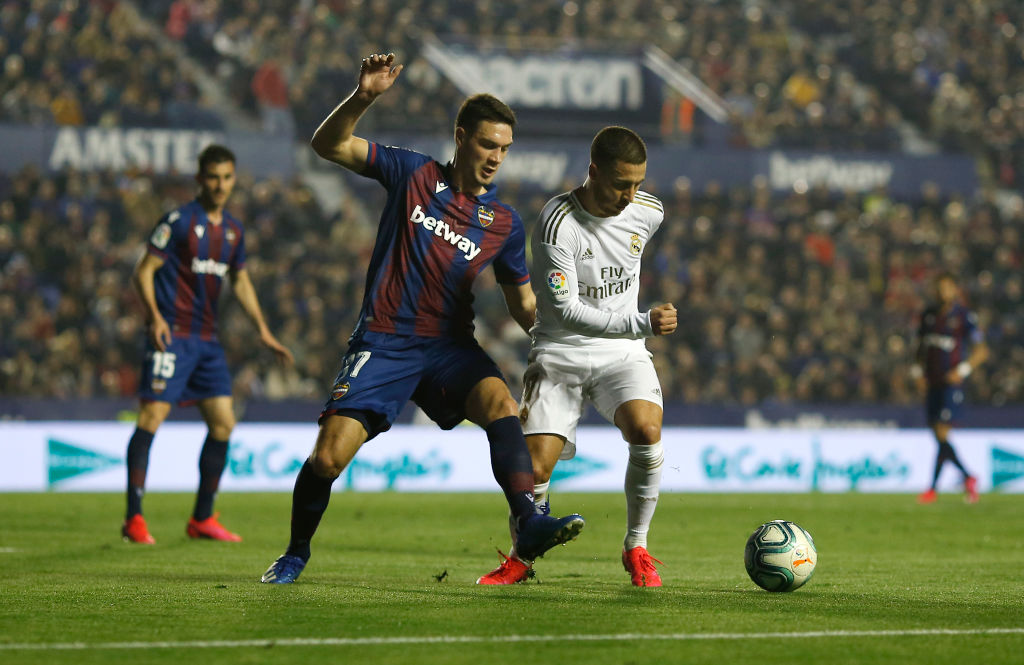 VALENCIA, SPAIN - FEBRUARY 22: Eden Hazard of Real Madrid is challenged by Nikola Vukcevic of Levante UD during the La Liga match between Levante UD and Real Madrid CF at Ciutat de Valencia on February 22, 2020 in Valencia, Spain. (Photo by Eric Alonso/Getty Images)