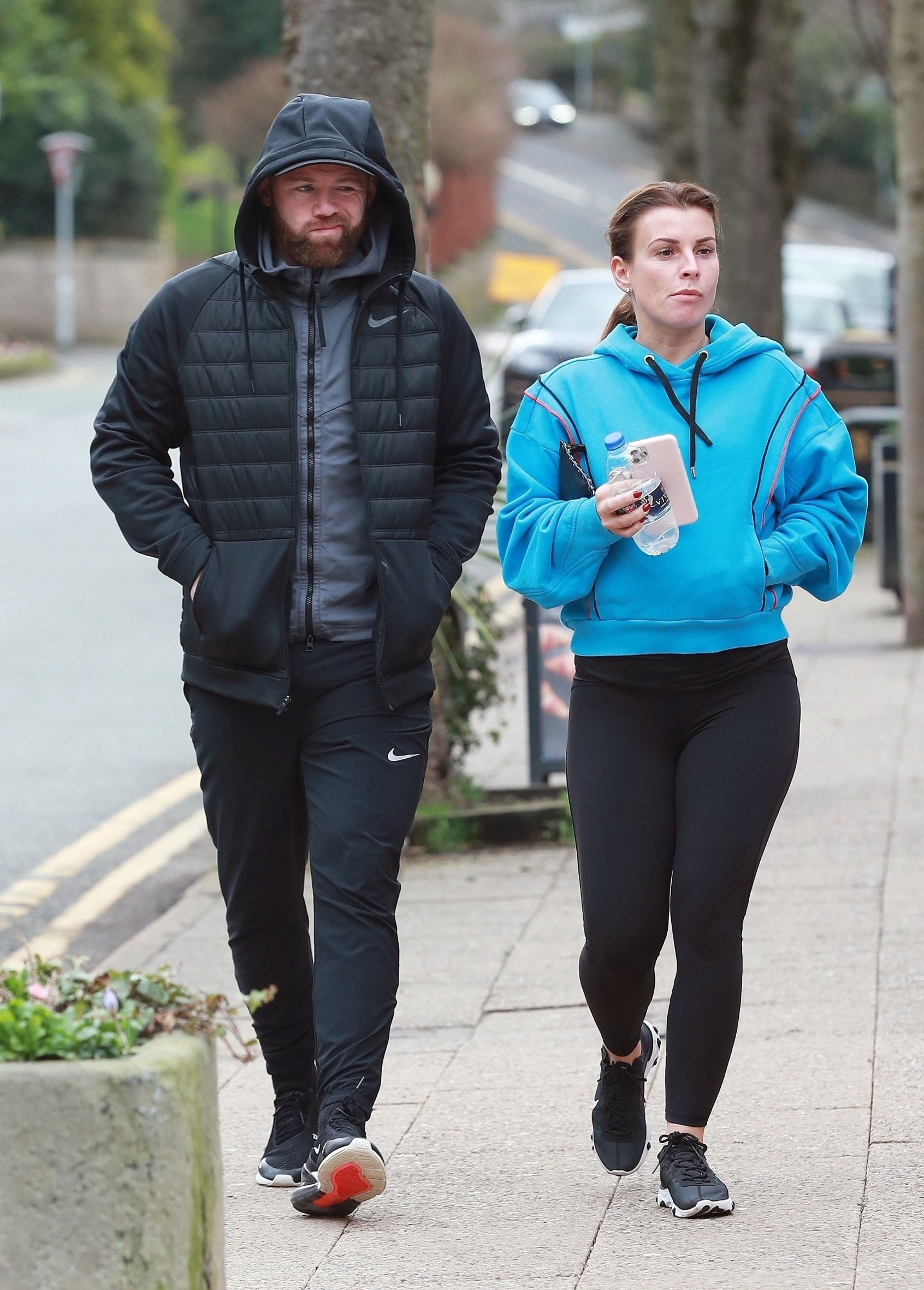 Cheshire, UNITED KINGDOM  - *EXCLUSIVE*  - **STRICTLY NOT AVAILABLE FOR MAIL ONLINE**

Former England International Footballer Wayne Rooney who now applies his trade at the Championship side Derby County is spotted out with his wife Coleen taking a stroll around Alderley Edge. 

Coleen looked sporty in her gym gear wearing black leggings and a blue hooded top holding a bottle of water in hand as a bearded Wayne wore a black hooded Nike jacket.

BACKGRID UK 17 FEBRUARY 2020, Image: 499058750, License: Rights-managed, Restrictions: , Model Release: no, Credit line: Stephen Crawshaw / BACKGRID / Backgrid UK / Profimedia
