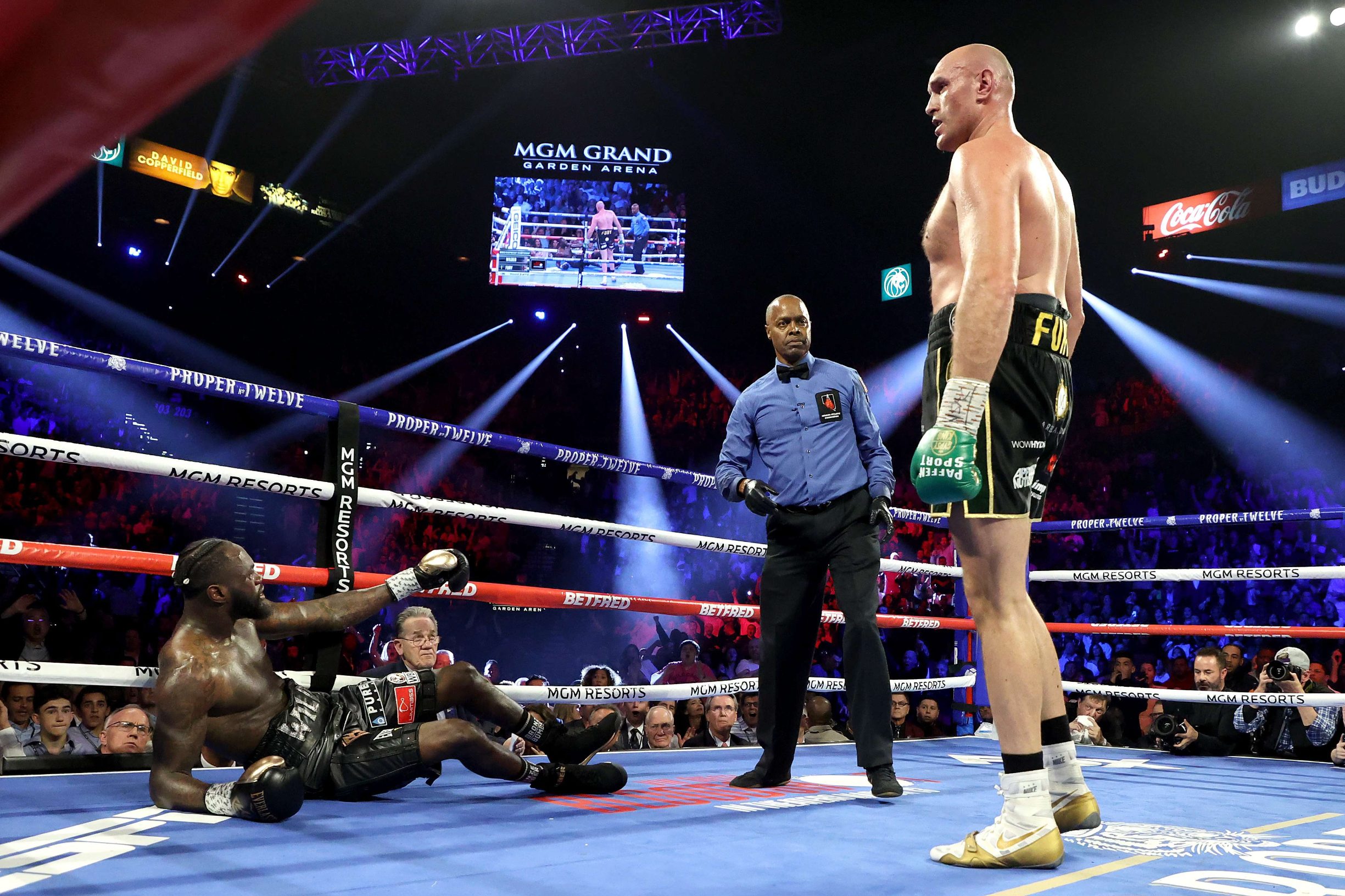LAS VEGAS, NEVADA - FEBRUARY 22: Tyson Fury knocks down Deontay Wilder in the third round during their Heavyweight bout for Wilder's WBC and Fury's lineal heavyweight title on February 22, 2020 at MGM Grand Garden Arena in Las Vegas, Nevada.   Al Bello/Getty Images/AFP
== FOR NEWSPAPERS, INTERNET, TELCOS & TELEVISION USE ONLY ==