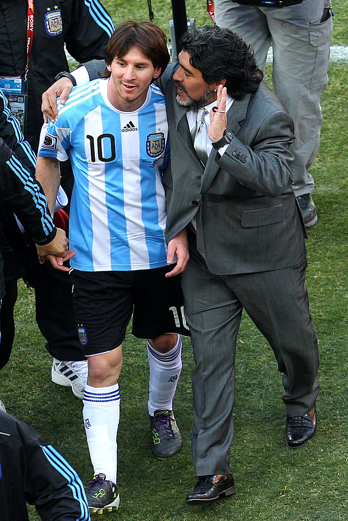 JOHANNESBURG, SOUTH AFRICA - JUNE 17:  Diego Maradona head coach of Argentina talks with Lionel Messi of Argentina as they celebrate victory after the 2010 FIFA World Cup South Africa Group B match between Argentina and South Korea at Soccer City Stadium on June 17, 2010 in Johannesburg, South Africa.  (Photo by Cameron Spencer/Getty Images)