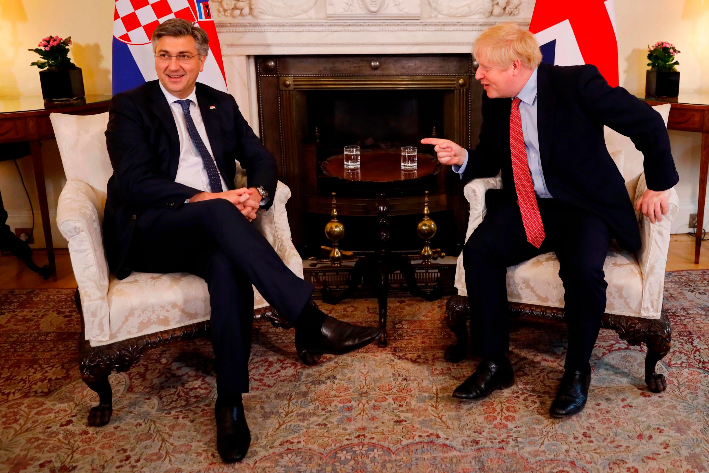 Britain's Prime Minister Boris Johnson (R) and Croatia's Prime Minister Andrej Plenkovic (L) sit down for a meeting at 10 Downing Street in London on February 24, 2020