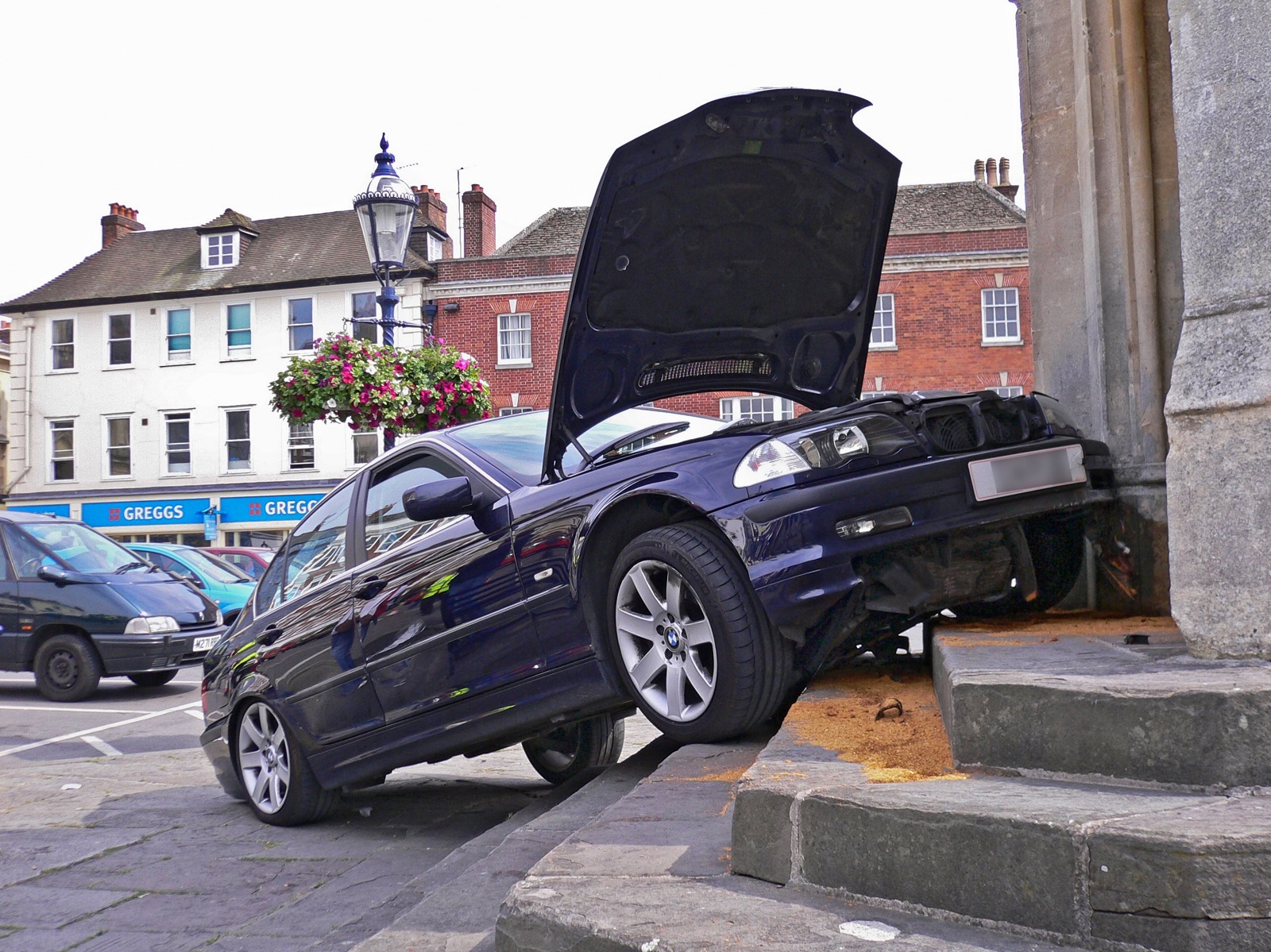 An orginal way to park a  The car over ran while trying to park and ran up the stone steps of the market cross, Image: 11399786, License: Rights-managed, Restrictions: , Model Release: no, Credit line: David Askham / Alamy / Profimedia
