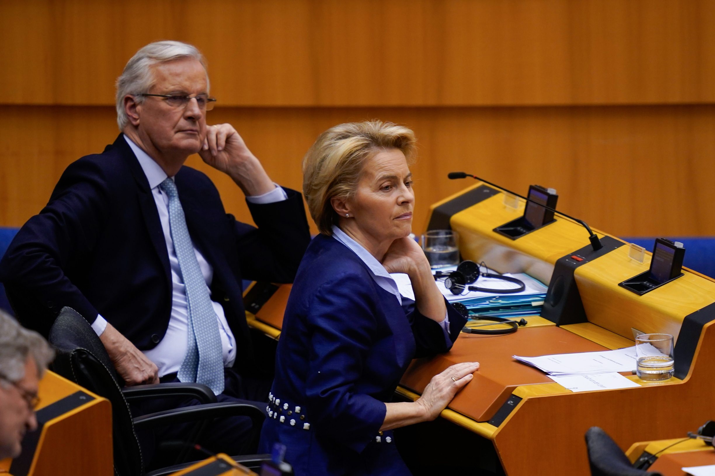 European Commission Chief Negociator Michel Barnier (L) and President of the European Commission Ursula von der Leyen look on during a plenary session in Brussels on January 29, 2020, as Brexit Day is to be set in stone when the European Parliament casts a vote ratifying the terms of Britain's divorce deal from the EU. (Photo by Kenzo TRIBOUILLARD / AFP)