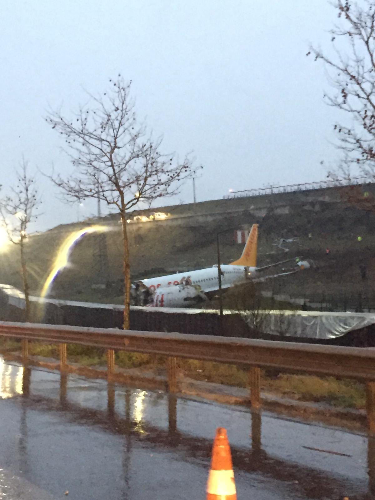 This picture taken on February 05, 2020, shows a Pegasus airlines boeing 737 plane after it skidded off the runway at Istanbul's Sabiha Gokcen airport. - A plane carrying 171 passengers skidded off the runway at an Istanbul airport and split into two after landing in rough weather on February 05, but officials said no-one had died. The aircraft had flown into Istanbul's Sabiha Gokcen airport from the Aegean city of Izmir in very wet weather, NTV broadcaster reported. At least 21 people were injured and taken to hospital, Istanbul Governor Ali Yerlikaya said on Twitter. 