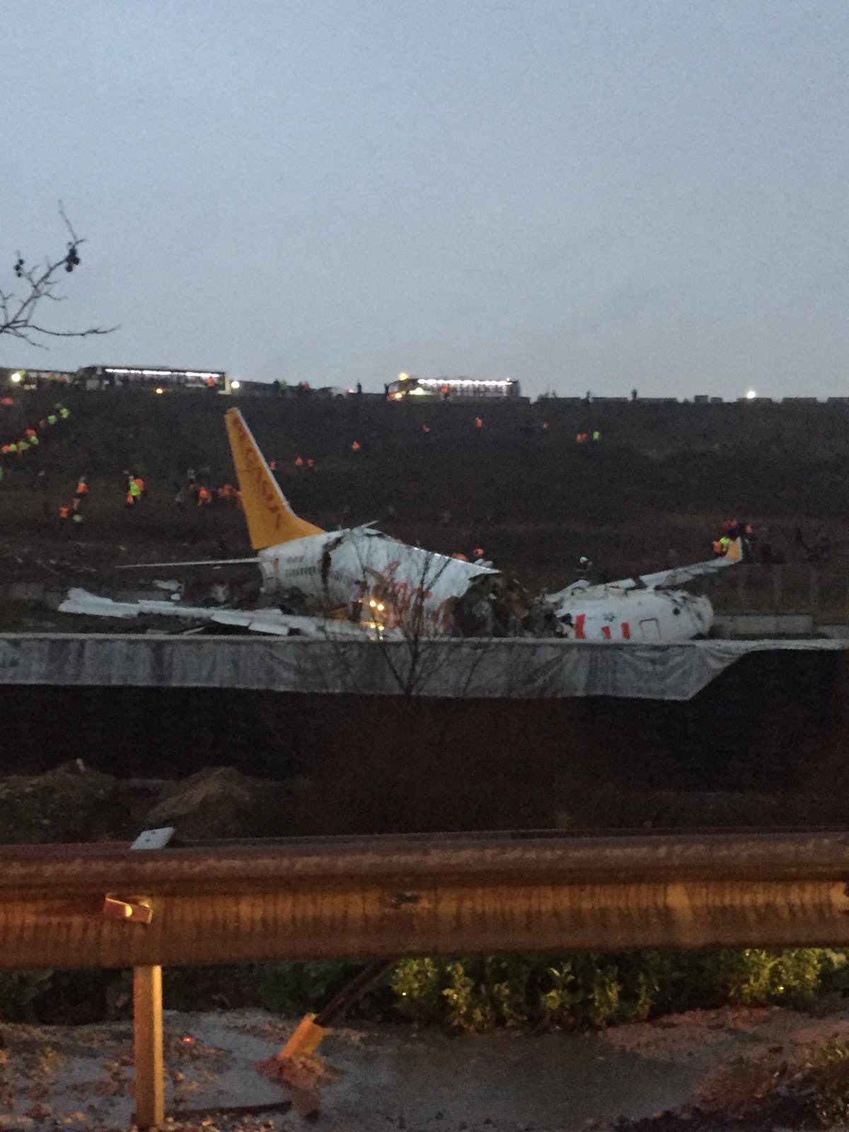 This picture taken on February 05, 2020, shows a Pegasus airlines boeing 737 plane after it skidded off the runway at Istanbul's Sabiha Gokcen airport. - A plane carrying 171 passengers skidded off the runway at an Istanbul airport and split into two after landing in rough weather on February 05, but officials said no-one had died. The aircraft had flown into Istanbul's Sabiha Gokcen airport from the Aegean city of Izmir in very wet weather, NTV broadcaster reported. At least 21 people were injured and taken to hospital, Istanbul Governor Ali Yerlikaya said on Twitter. 