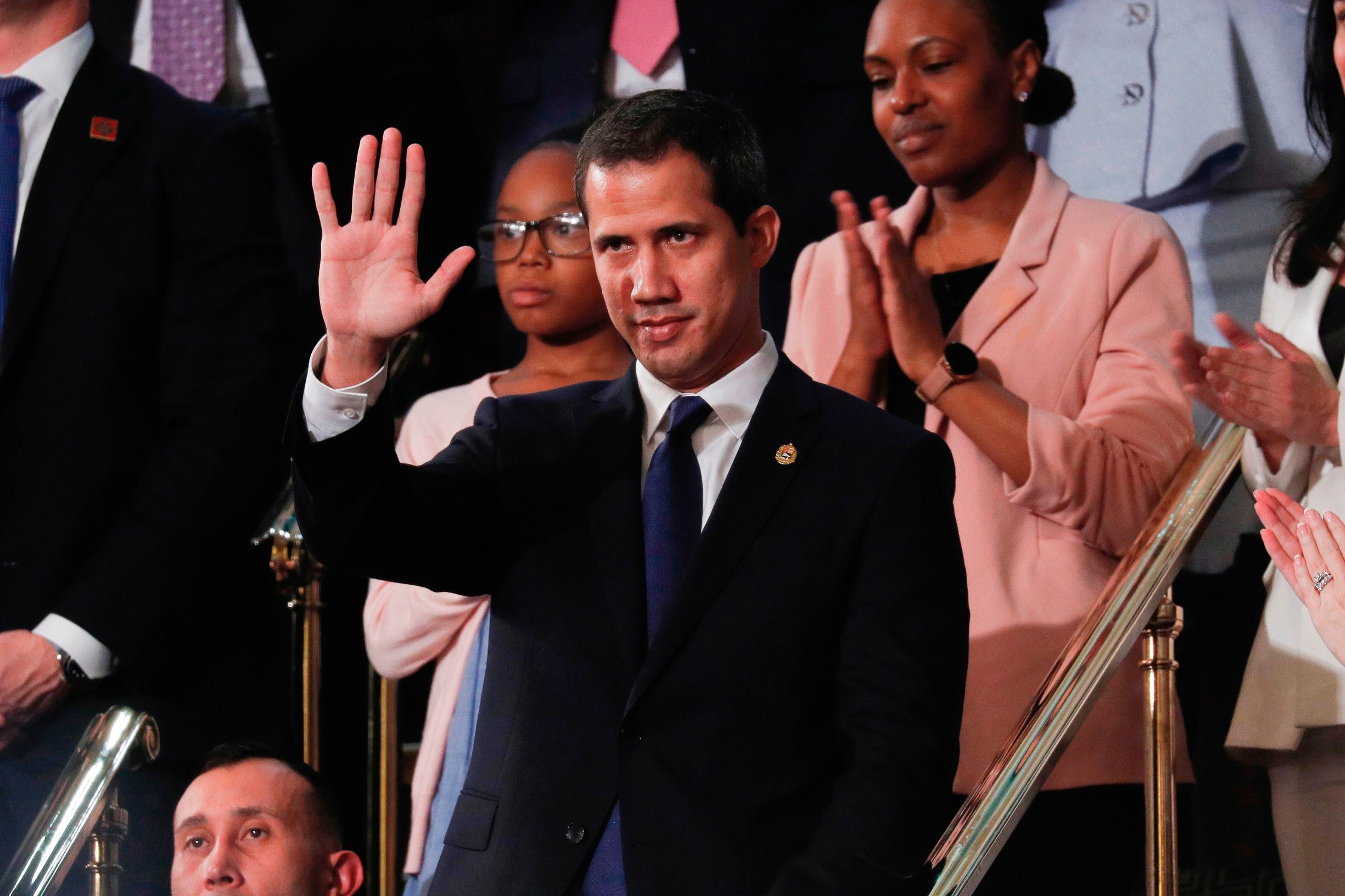 Venezuela's opposition leader Juan Guaido waves after being acknowledged by US President Donald Trump as he delivers the State of the Union address at the US Capitol in Washington, DC, on February 4, 2020. (Photo by LEAH MILLIS / POOL / AFP)
