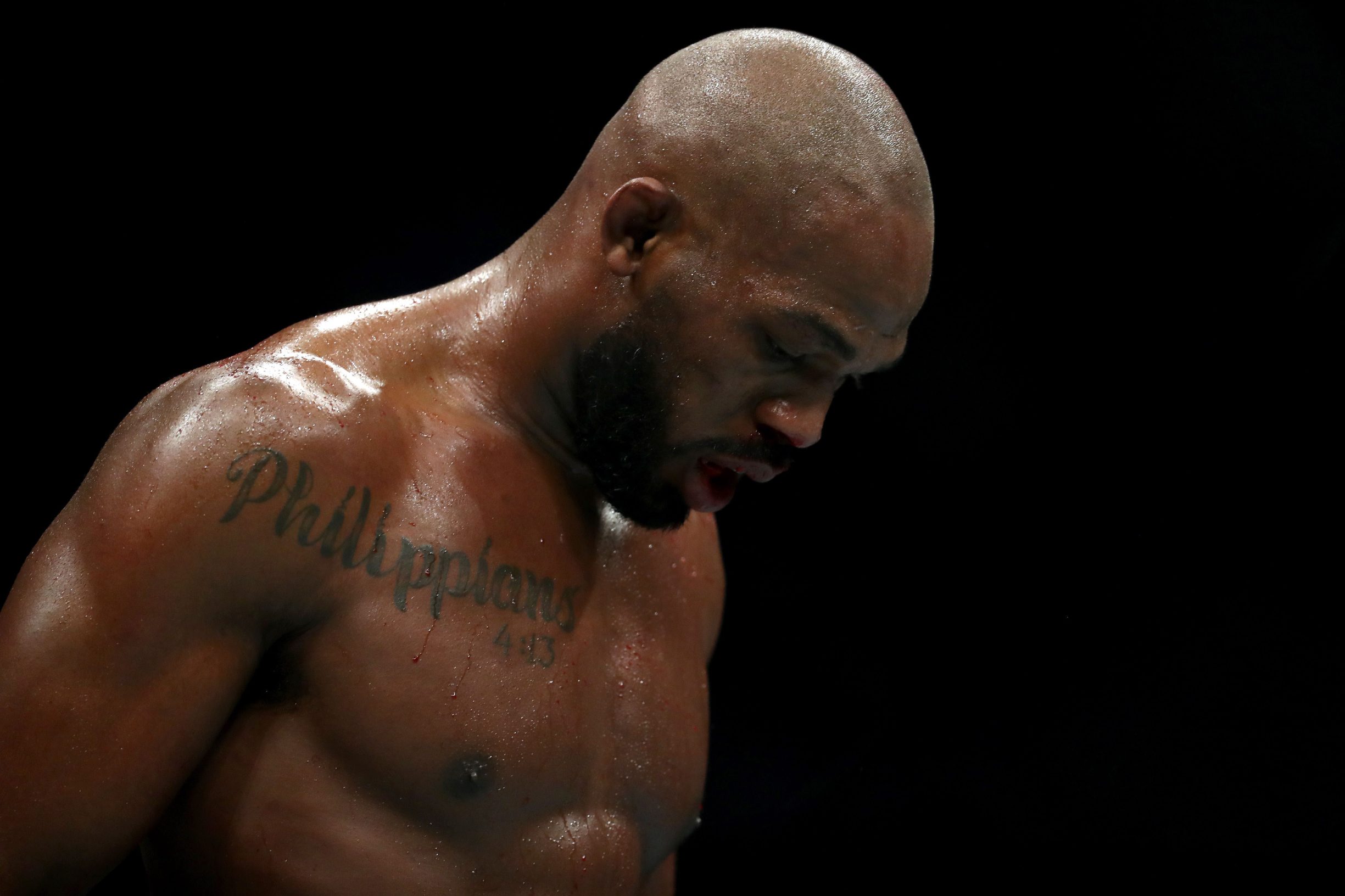 HOUSTON, TEXAS - FEBRUARY 08: Jon Jones walks to his corner in between rounds against Dominick Reyes in their UFC Light Heavyweight Championship bout during UFC 247 at Toyota Center on February 08, 2020 in Houston, Texas.   Ronald Martinez/Getty Images/AFP
== FOR NEWSPAPERS, INTERNET, TELCOS & TELEVISION USE ONLY ==