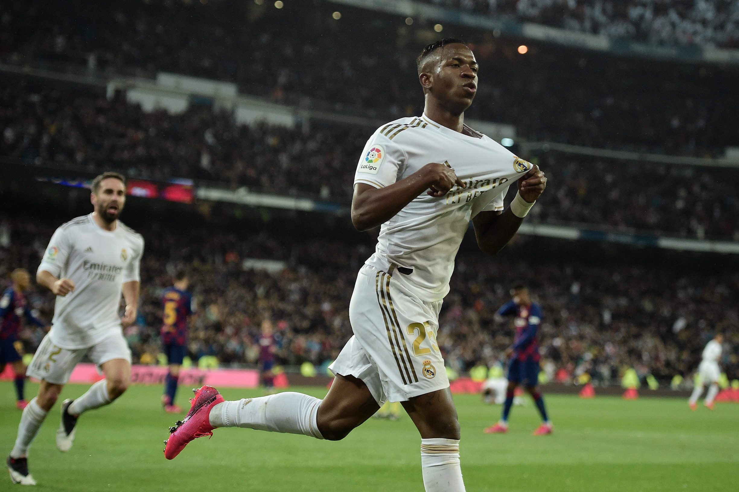 Real Madrid's Brazilian forward Vinicius Junior celebrates a goal during the Spanish League football match between Real Madrid and Barcelona at the Santiago Bernabeu stadium in Madrid on March 1, 2020. (Photo by OSCAR DEL POZO / AFP)