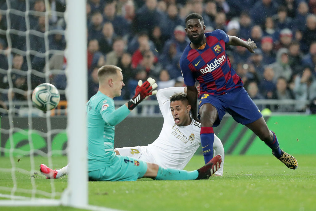 MADRID, SPAIN - MARCH 01: Mariano of Real Madrid scores his team's second goal past Samuel Umtiti of FC Barcelona and Marc-Andre Ter Stegen of FC Barcelona during the Liga match between Real Madrid CF and FC Barcelona at Estadio Santiago Bernabeu on March 01, 2020 in Madrid, Spain. (Photo by Gonzalo Arroyo Moreno/Getty Images)