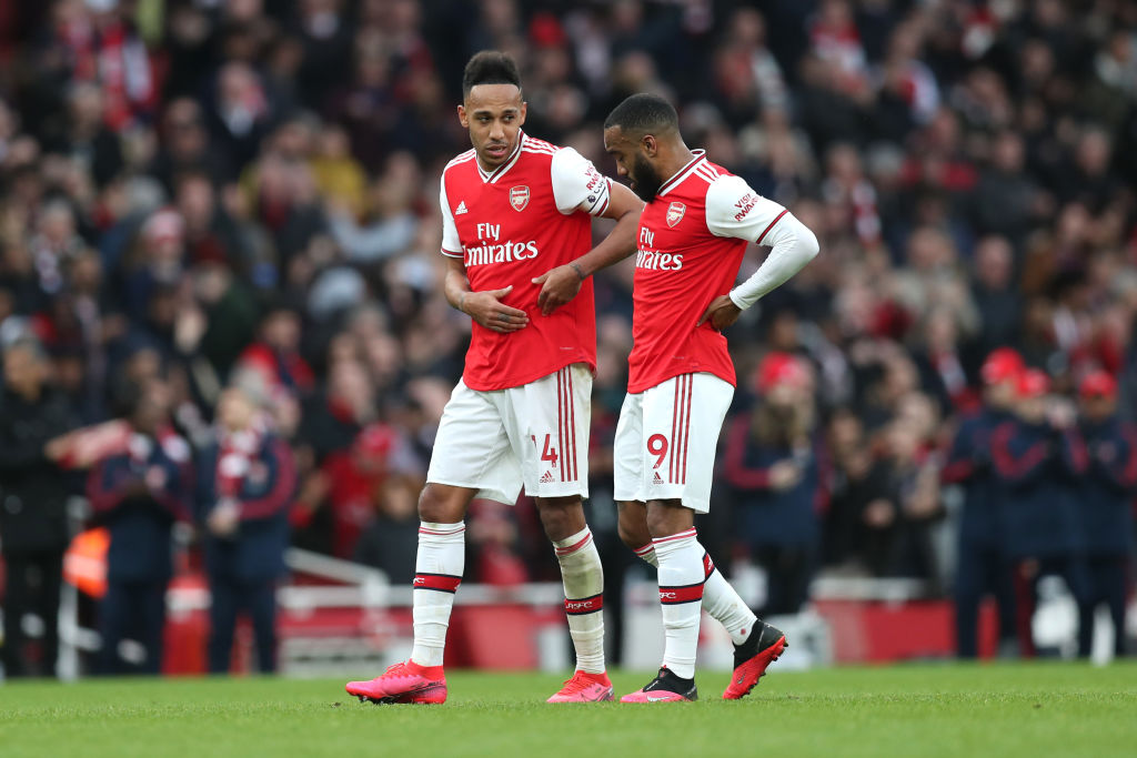 LONDON, ENGLAND - MARCH 07: Pierre-Emerick Aubameyang and Alexandre Lacazette of Arsenal talk following their sides victory in the Premier League match between Arsenal FC and West Ham United at Emirates Stadium on March 07, 2020 in London, United Kingdom. (Photo by Alex Morton/Getty Images)