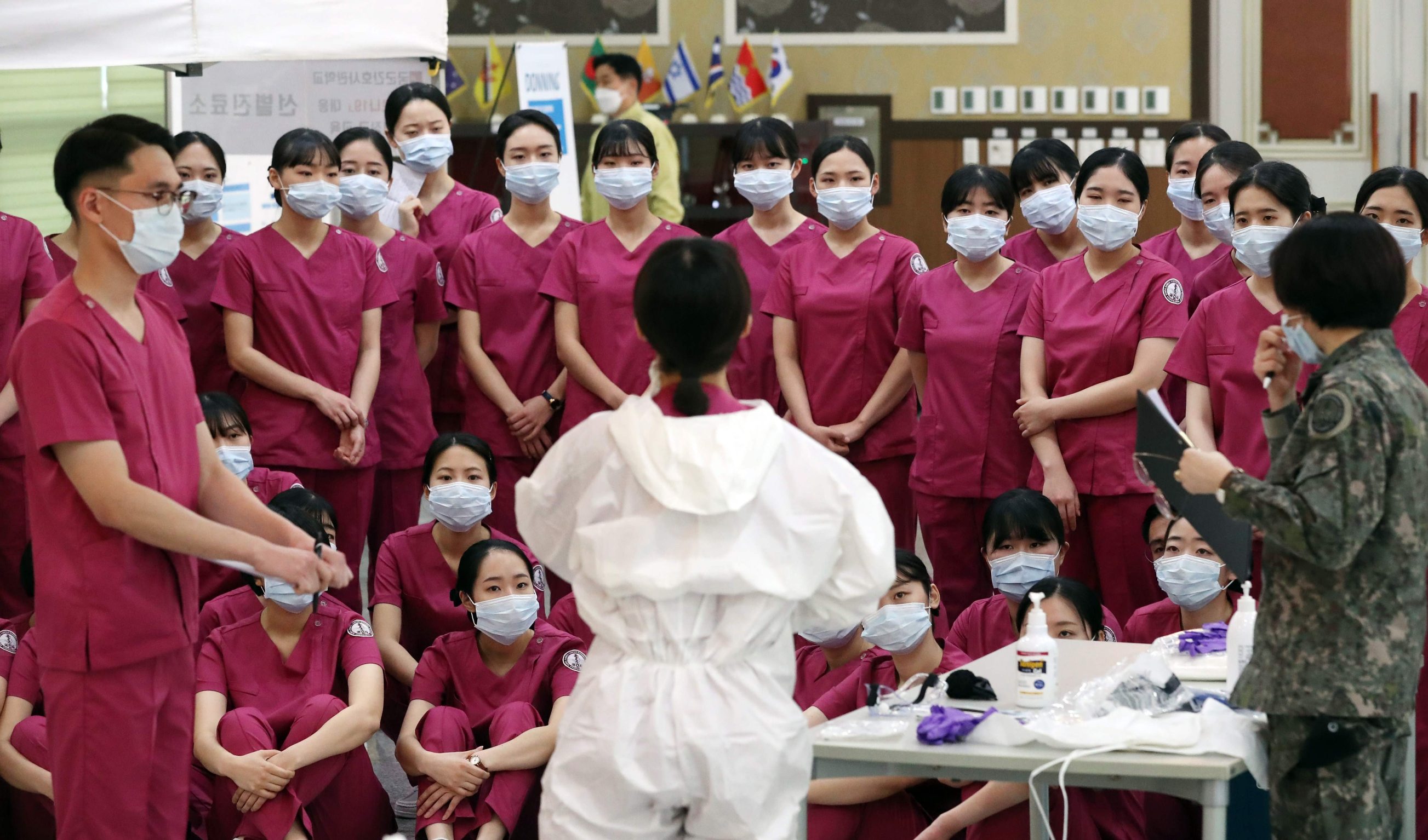 New nurse officers are trained on the COVID-19 coronavirus before heading to Daegu to help medical staff, at the Korea Armed Forces Nursing Academy in Daejeon on March 2, 2020. - South Korea confirmed 599 new coronavirus cases on March 2, taking the total to 4,335, health authorities said, while the death toll rose by eight to 26. (Photo by - / YONHAP / AFP) / - South Korea OUT / REPUBLIC OF KOREA OUT  NO ARCHIVES  RESTRICTED TO SUBSCRIPTION USE