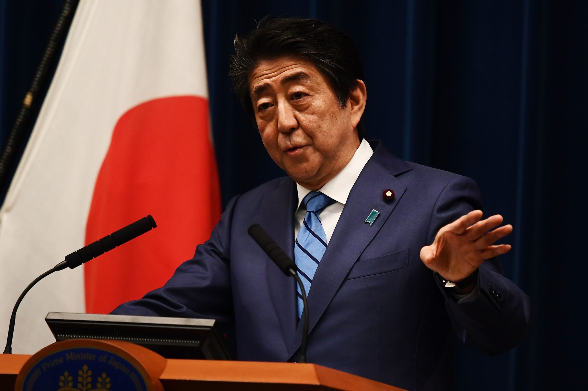 Japanese Prime Minister Shinzo Abe talks to the media during a press conference in Tokyo on March 14, 2020. (Photo by CHARLY TRIBALLEAU / AFP)