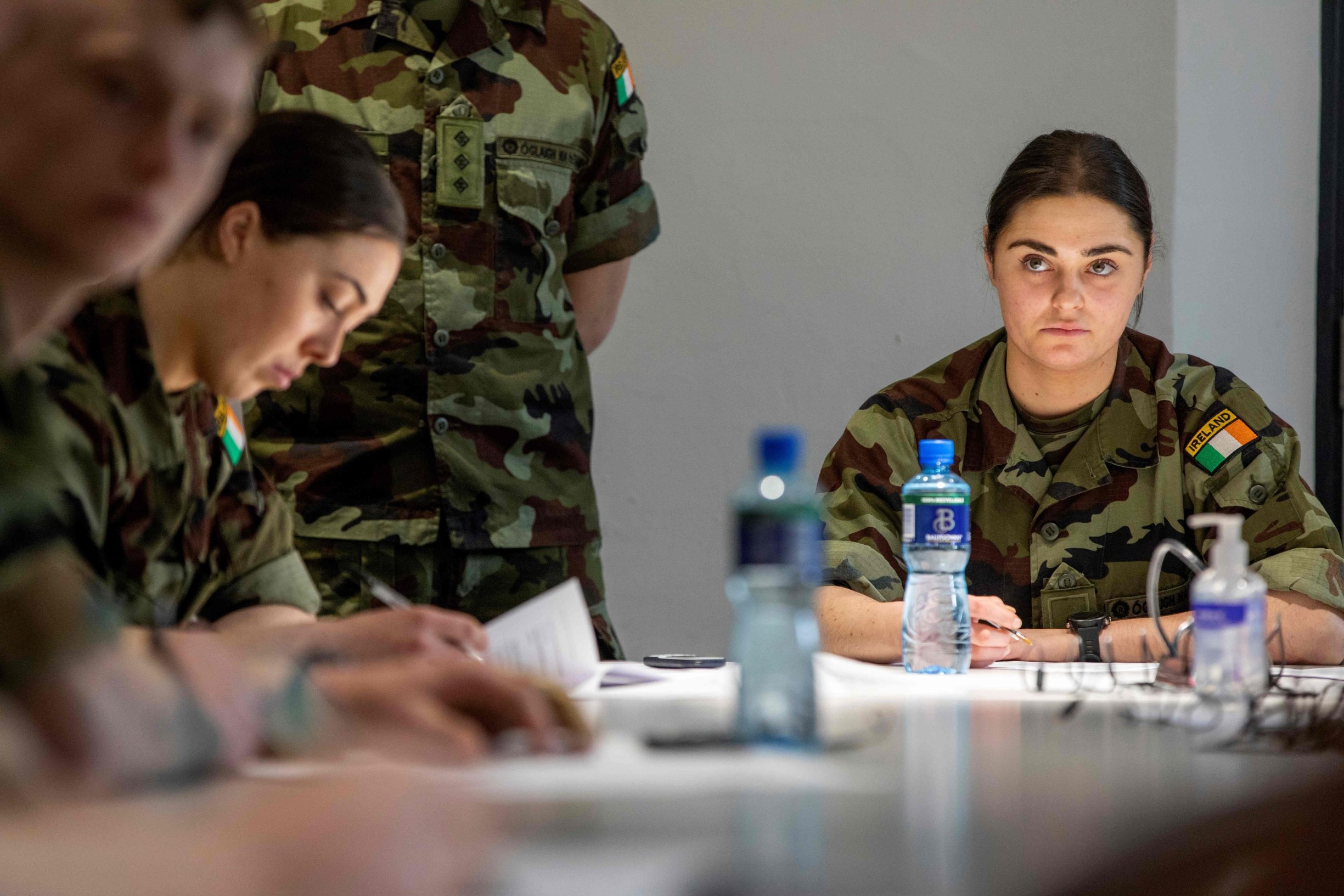 Irish Army cadets, who are being trained to assist with the staffing of a call cente handling contact tracing for coronavirus patients, are trained at Dr Steevens' Hospital in Dublin City centre, on March 13, 2020, as schools and universities closed on Thursday for two weeks with mass gatherings banned and social distancing strongly recommended. - The Republic has had 70 confirmed cases and one death from the COVID-19, well behind neighbouring Britain as well as Italy -- the hardest hit nation in Europe with more than a thousand deaths. (Photo by PAUL FAITH / AFP)