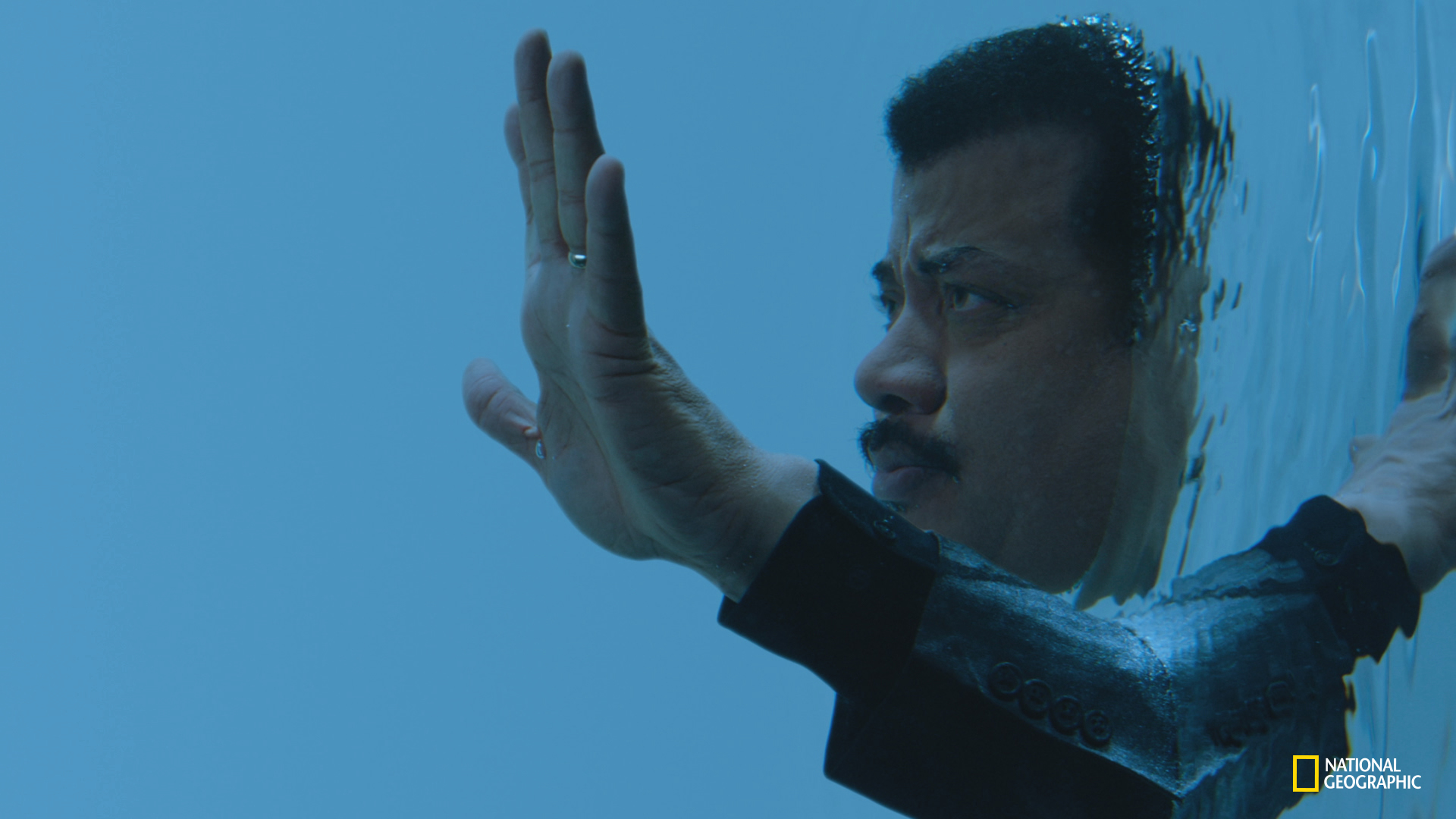 Host Neil deGrasse Tyson enters the Palace of Life, an imaginary place of ancient towers hidden by the mists of time and enshrouded in myth. Here, he moves into its largest, most ancient realm, to walk among the life at the bottom of the sea. COSMOS: POSSIBLE WORLDS premieres March 9, 2020 on National Geographic. (National Geographic/Cosmos Studios)
