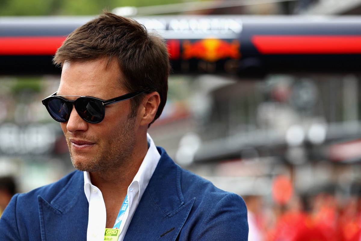 MONTE-CARLO, MONACO - MAY 27: NFL star Tom Brady looks on outside the Red Bull Racing garage before the Monaco Formula One Grand Prix at Circuit de Monaco on May 27, 2018 in Monte-Carlo, Monaco.  (Photo by Mark Thompson/Getty Images)