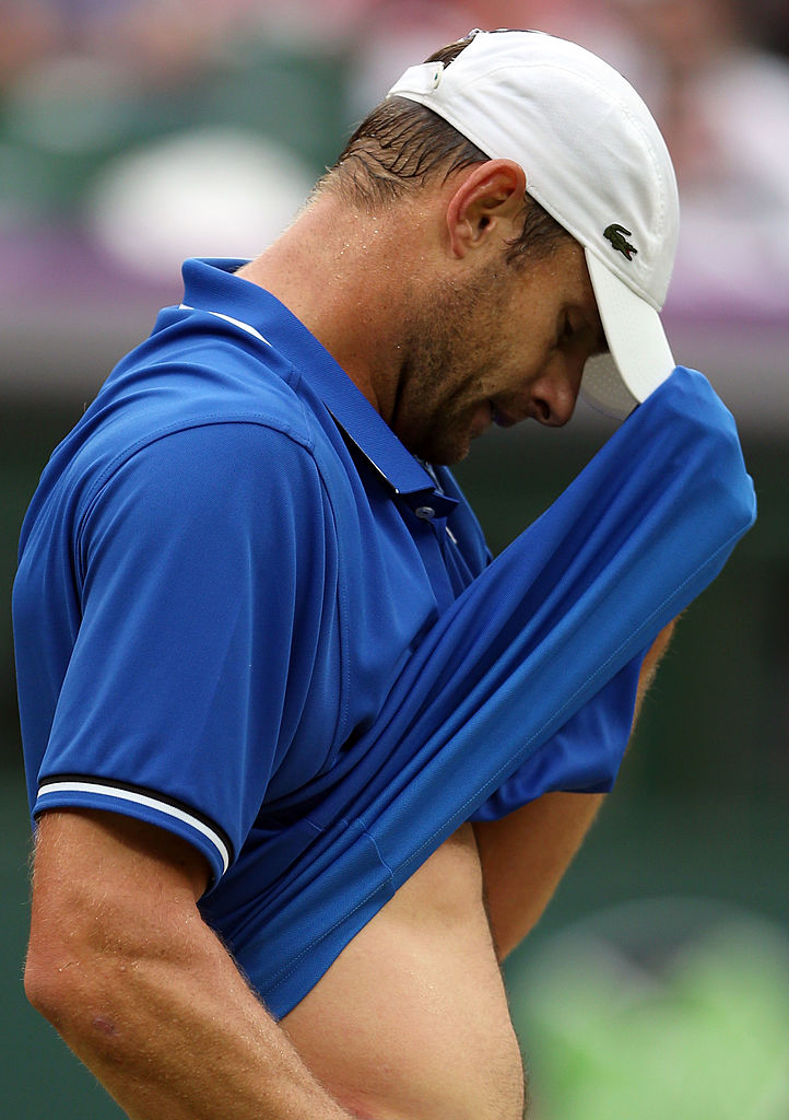 LONDON, ENGLAND - JULY 31:  Andy Roddick of the United States reacts after a point to Novak Djokovic of Serbia during the second round of Men's Singles Tennis on Day 4 of the London 2012 Olympic Games at Wimbledon on July 31, 2012 in London, England.  (Photo by Clive Brunskill/Getty Images)