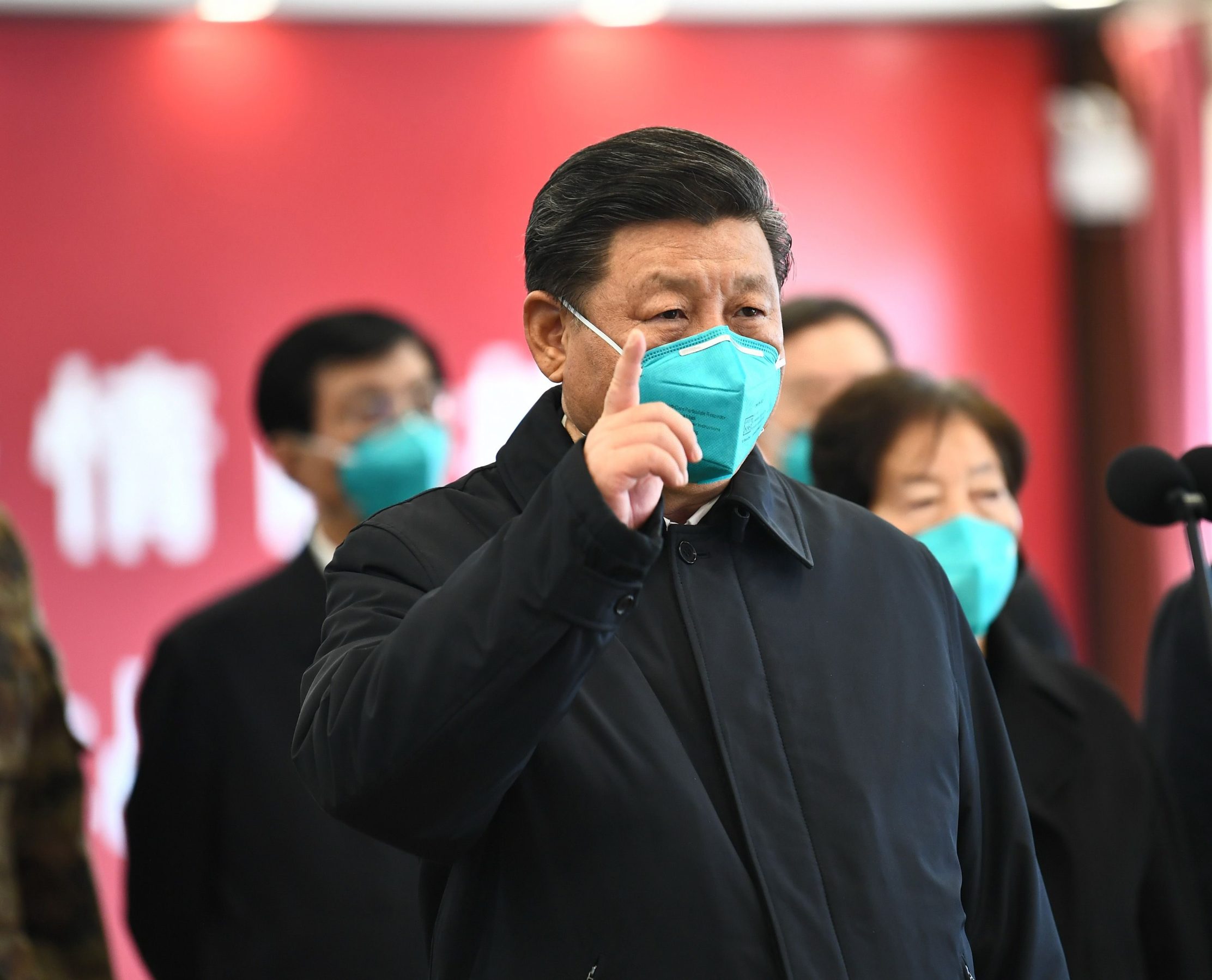 This photo released on March 10, 2020 by China's Xinhua News Agency shows Chinese President Xi Jinping wearing a mask as he GESTURES to a coronavirus patient and medical staff via a video link at the Huoshenshan hospital in Wuhan, in China's central Hubei province on March 10, 2020. (Photo by Xie Huanchi / XINHUA / AFP) / China OUT - Hong Kong OUT - Japan OUT - Germany OUT - United States OUT - United Kingdom OUT / -----EDITORS NOTE---- RESTRICTED TO EDITORIAL USE - ONE TIME USE - MANDATORY CREDIT 