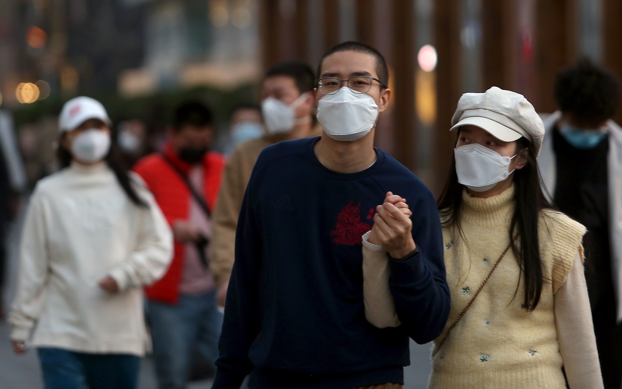 Chinese still wear protective face masks while visiting a shopping area as the threat of the deadly coronavirus (Covid-19) fades in Beijing on Sunday, March 22, 2020.  China has reported no new locally transmitted coronavirus cases for the first time since the pandemic began.   Photo by /UPI, Image: 508527032, License: Rights-managed, Restrictions: , Model Release: no, Credit line: STEPHEN SHAVER / UPI / Profimedia