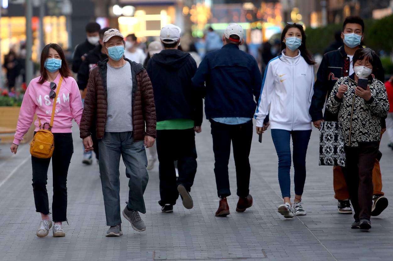 Chinese still wear protective face masks while visiting a shopping area as the threat of the deadly coronavirus (Covid-19) fades in Beijing on Sunday, March 22, 2020.  China has reported no new locally transmitted coronavirus cases for the first time since the pandemic began.   Photo by /UPI, Image: 508527044, License: Rights-managed, Restrictions: , Model Release: no, Credit line: STEPHEN SHAVER / UPI / Profimedia