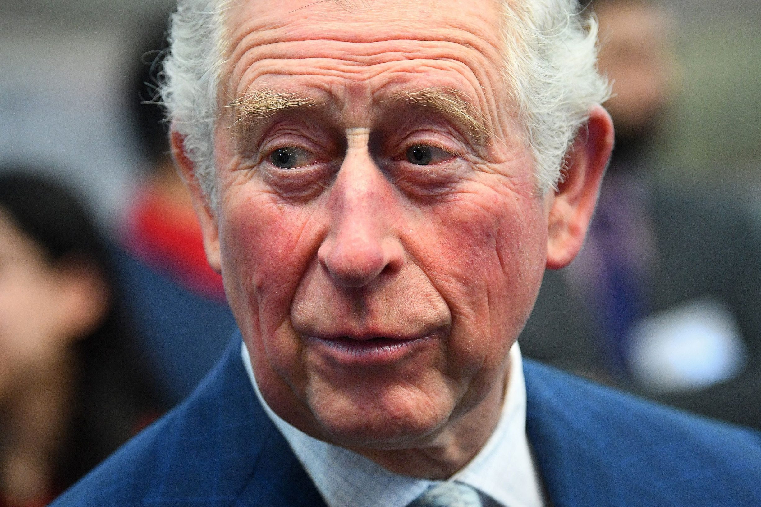 (FILES) In this file photo taken on March 04, 2020 Britain's Prince Charles, Prince of Wales reacts during his visit to the London Transport Museum in London on March 4, 2020, to take part in celebrations to mark 20 years of the museum. - Prince Charles, the eldest son and heir to Queen Elizabeth II, has tested positive for the new coronavirus, his office said on March 25, 2020. The 71-year-old is displaying mild symptoms of COVID-19 