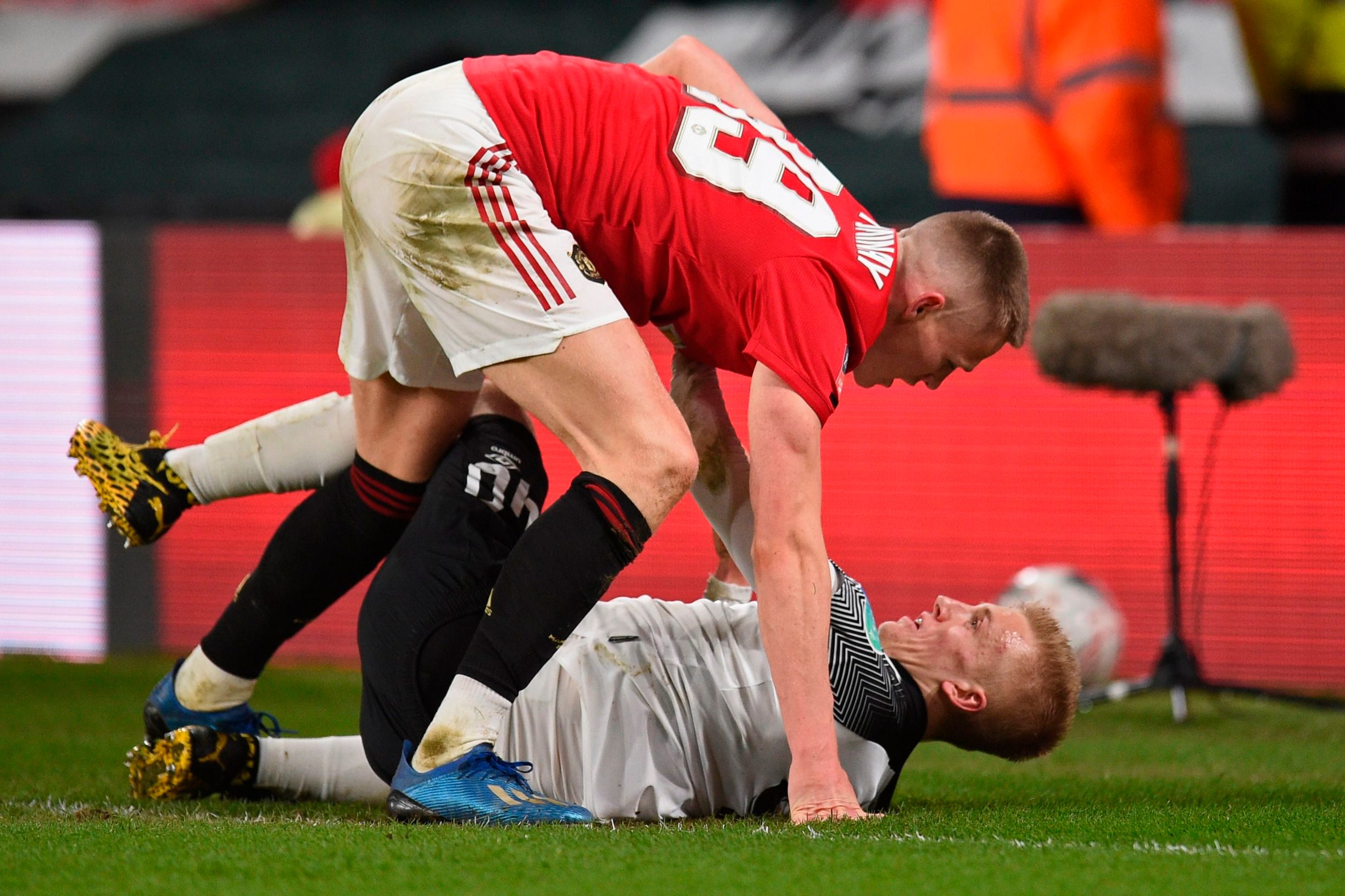 Manchester United's Scottish midfielder Scott McTominay (up) clashes with Derby County's English midfielder Louie Sibley during the English FA Cup fifth round football match between Derby County and Manchester United at Pride Park Stadium in Derby, central England on March 5, 2020. (Photo by Oli SCARFF / AFP) / RESTRICTED TO EDITORIAL USE. No use with unauthorized audio, video, data, fixture lists, club/league logos or 'live' services. Online in-match use limited to 120 images. An additional 40 images may be used in extra time. No video emulation. Social media in-match use limited to 120 images. An additional 40 images may be used in extra time. No use in betting publications, games or single club/league/player publications. / 