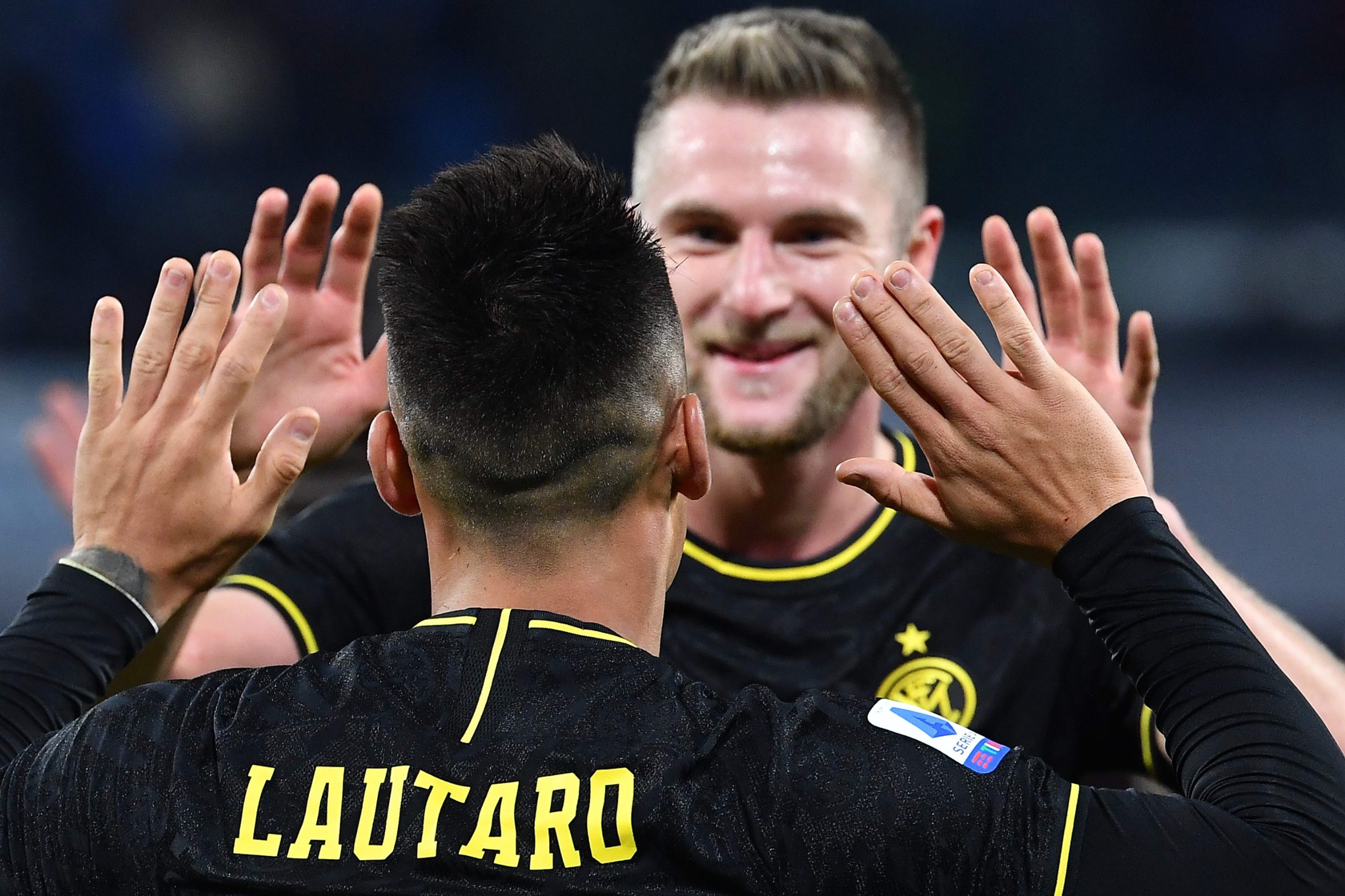 Inter Milan's Argentinian forward Lautaro Martinez (Front) celebrates with Inter Milan's Slovakian defender Milan Skriniar after scoring  during the Italian Serie A football match Napoli vs Inter Milan on January 6, 2020 at the San Paolo stadium in Naples. (Photo by Tiziana FABI / AFP)