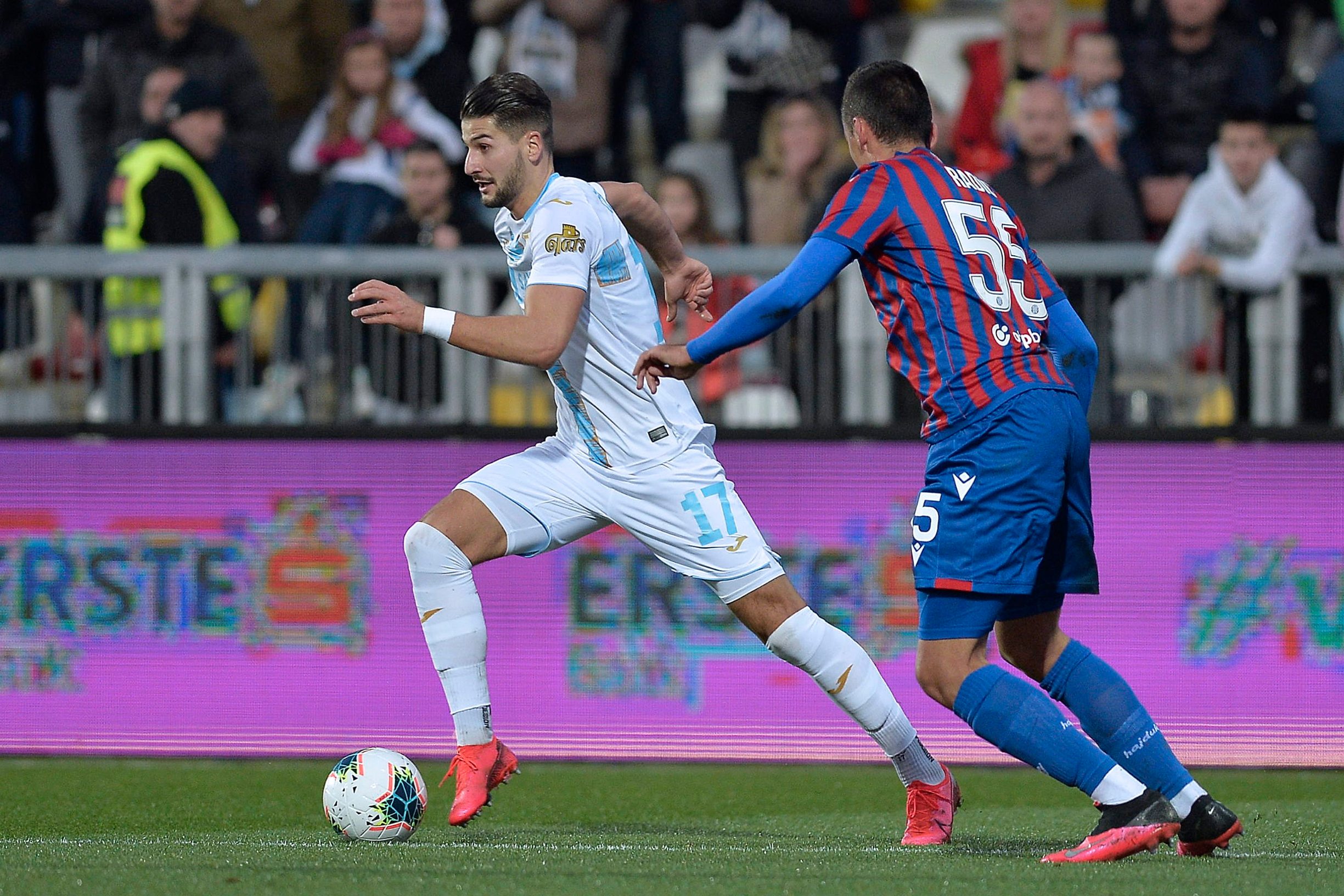 Zagreb, 080320.
Stadion Rujevica.
Hrvatski Telekom Prva liga, 1.HNL, 26.kolo, seniori, utakmica: Rijeka - Hajduk.
Na fotografiji:  Antonio Mirko Colakm, Stipe Radic.
Foto: Damir Krajac / CROPIX