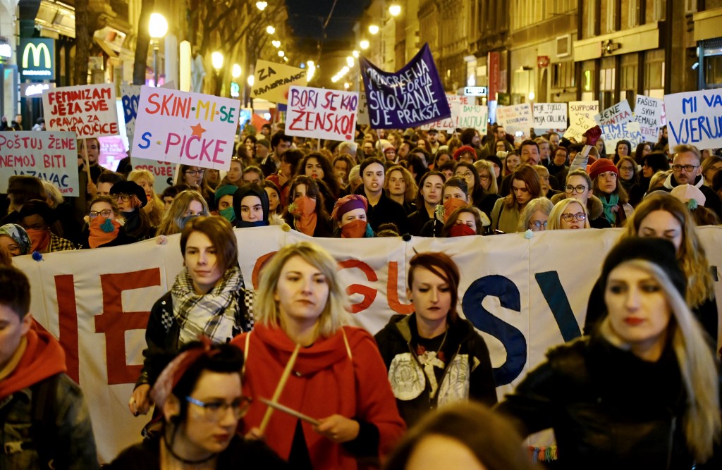 Women take part in a rally marking International Women's Day in the Croatian capital Zagreb on March 8, 2020. - Thousands took to the streets across the globe to mark International Women's Day despite the coronavirus outbreak forcing the cancellation of a slew of events in Asia, as violence marred some European gatherings. (Photo by Denis LOVROVIC / AFP)