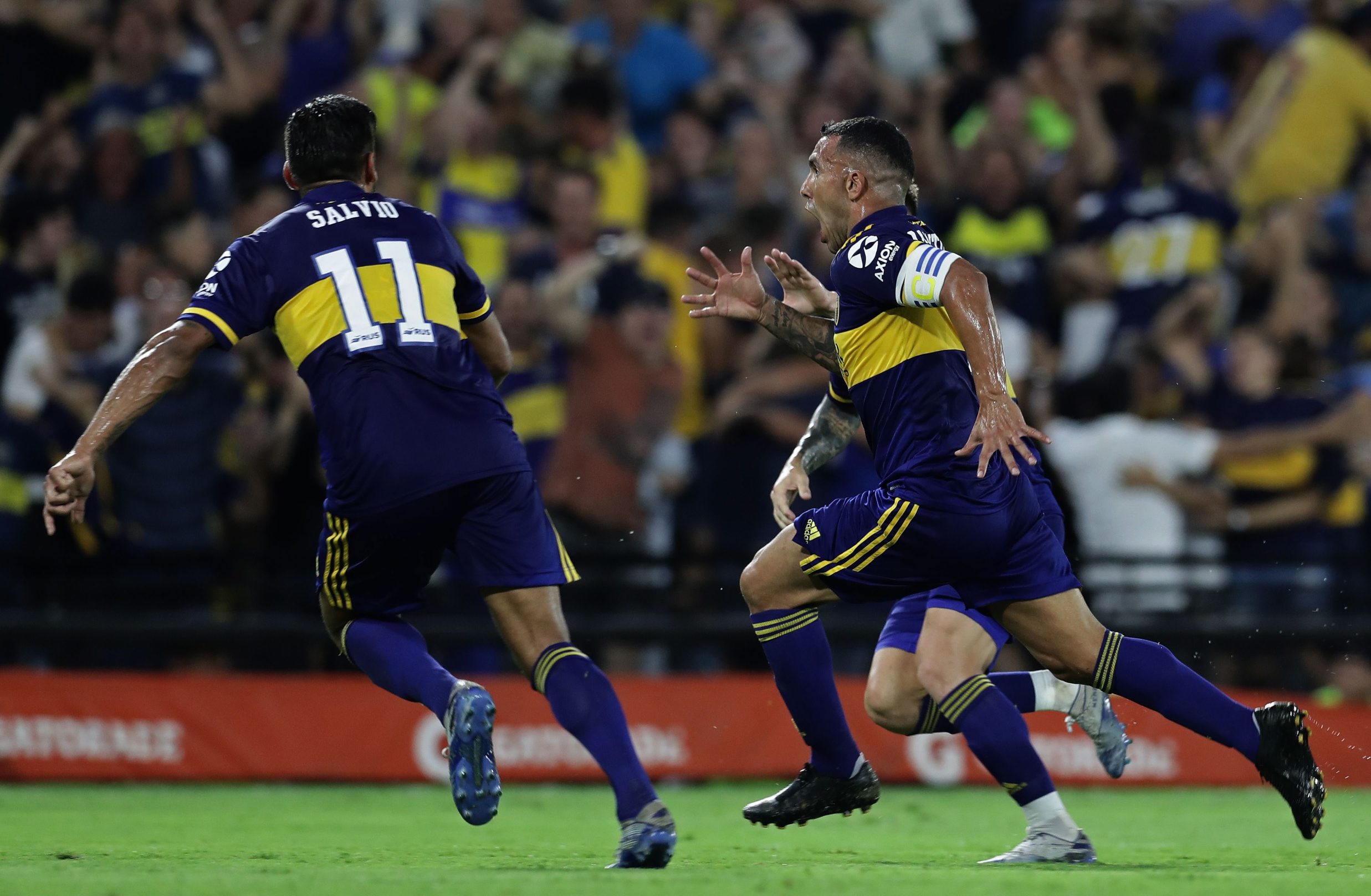 Boca Juniors' forward Carlos Tevez (R) celebrates after scoring a goal against Gimnasia y Esgrima during their Argentina First Division 2020 Superliga Tournament football match at La Bombonera stadium, in Buenos Aires, on March 7, 2020. (Photo by ALEJANDRO PAGNI / AFP)