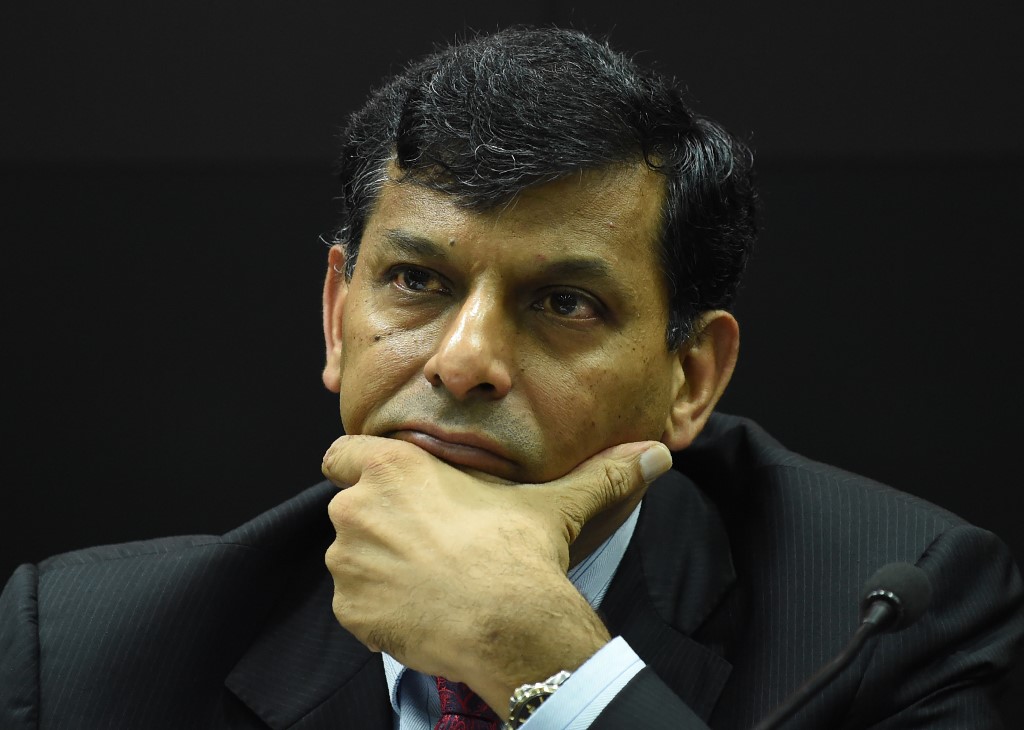Governor of The Reserve Bank of India (RBI) Raghuram Rajan listens to a question as he addresses media representatives at a press conference in Mumbai on August 9, 2016. - India's Raghuram Rajan kept interest rates on hold in a bid to wrestle down inflation, in his final policy review as central bank chief. In a widely expected move, the popular Reserve Bank of India governor said he would hold the benchmark repo rate, the level at which it lends to commercial banks, at 6.50 percent. (Photo by PUNIT PARANJPE / AFP)