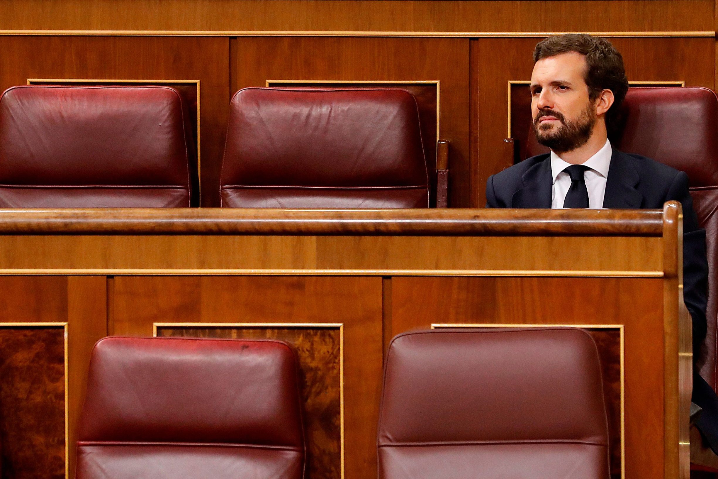 Spanish People's Party (PP) leader Pablo Casado attends the prime minister's question time session held for the first time since the state of alarm was declared at the Lower Chamber of the Spanish parliament in Madrid on April 15, 2020. - Spain's daily death toll from the coronavirus fell to 523, after posting a one-day rise, bringing the total number of fatalities to 18,579, the health ministry said. (Photo by Andres BALLESTEROS / POOL / AFP)