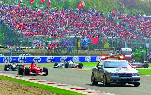 safety car leads the pack ahead of German Ferrari driver Michael Schumacher Finnish McLaren-Mercedes Mika Hakkinen and Canadian Bar-Honda driver Jacques Villeneuve after the crash at the second chicane of the Monza racetrack, prior to the second start of the Italian Formula One Grand Prix, 10 September 2000. AFP PHOTO  PATRICK HERTZOG, Image: 68961025, License: Rights-managed, Restrictions: , Model Release: no, Credit line: PATRICK HERTZOG / AFP / Profimedia