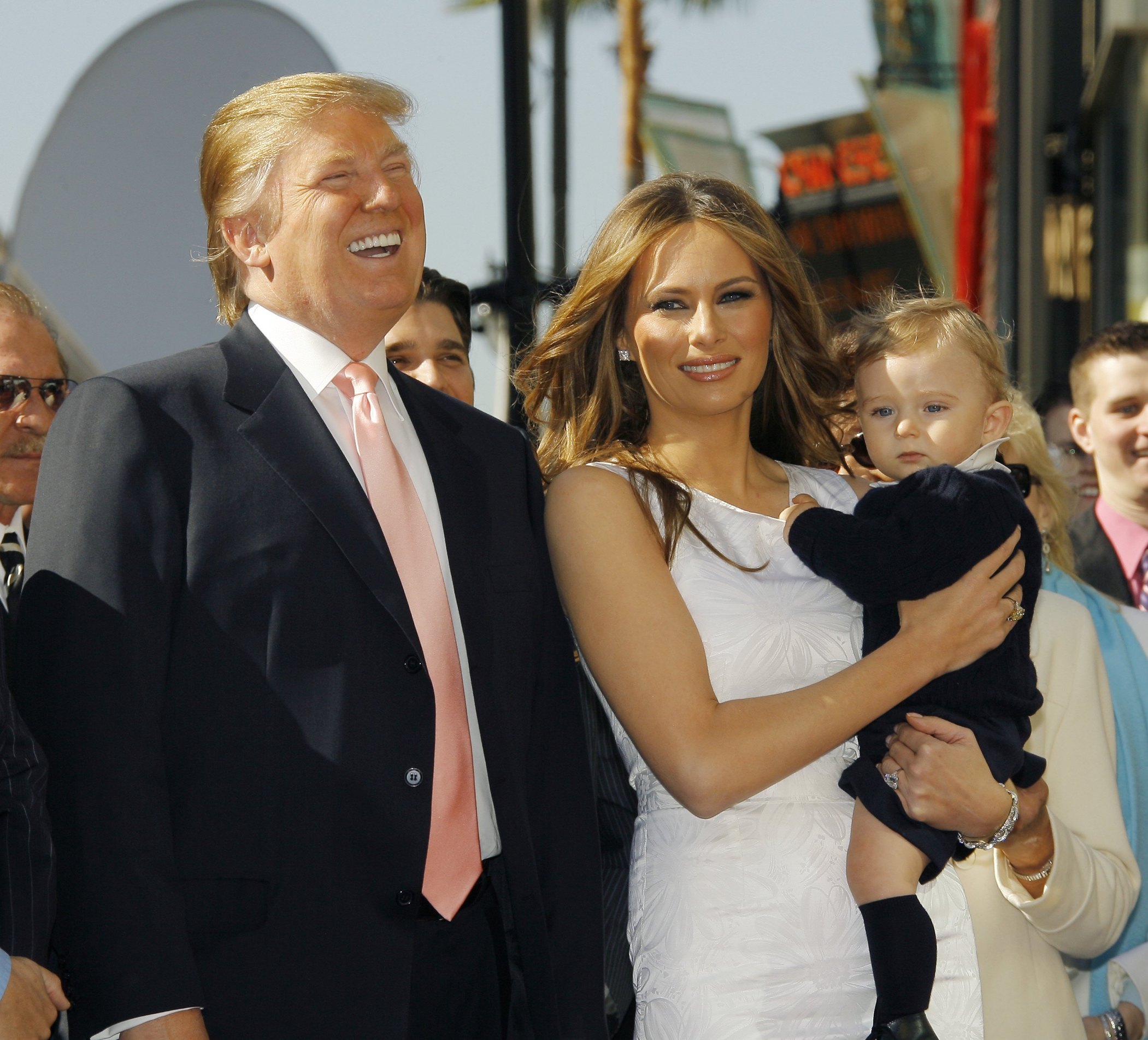 HOLLYWOOD, CA - JANIUARY 16:  Donald Trump (L) , wife Melania (C) and son Baron attend the ceremony honoring him with a star on the Hollywood Walk of Fame on January 16, 2006 in Hollywood, California. (Photo by Vince Bucci/Getty Images)