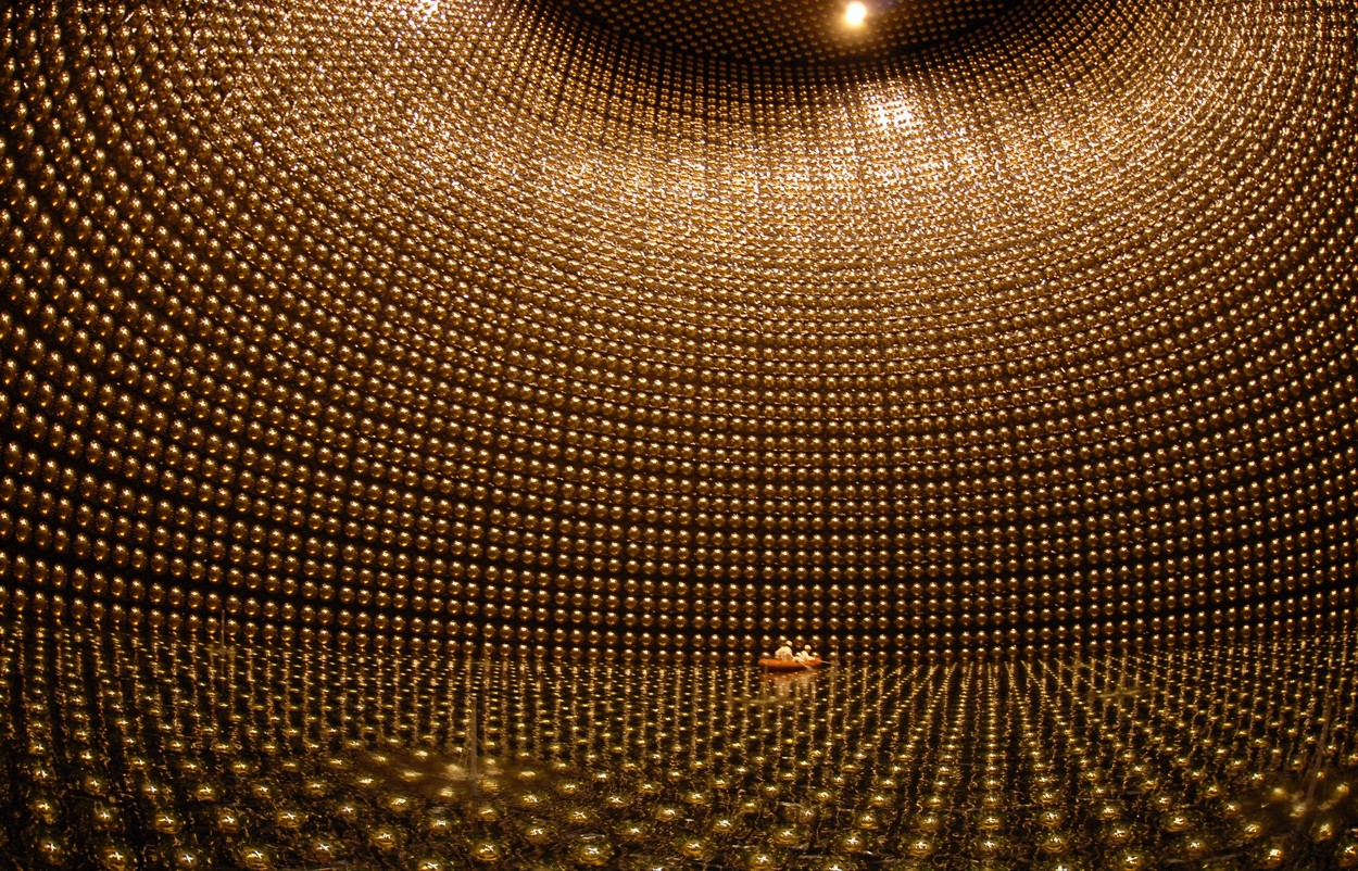 The Surreal World of Neutrino Detectors

Neutrinos are one of the fundamental particles which make up the universe, but not in the way electrons, protons and neutrons are. These particles are extremely tiny, nearly massless and electrically neutral so they are not affected by electromagnetic forces and react very weakly with other particles of nature. Neutrinos are produced by the decay of radioactive elements in nuclear reactions such as in the core of the sun or exploding stars. Once born, they travel in straight lines at the speed of light passing through solid matter almost entirely unhindered. Although tiny, they carry a colossal amount of energy Ń some of these carry the same amount of energy as a well hit tennis ball. To detect these particles using the same technology they use at the Large Hadron Collider in Switzerland, one would require a ring of magnets the size of Earth's orbit around the Sun.
Neutrino detectors therefore use entirely different kind of science and technology. Some detectors use large tanks filled with water and surrounded by photomultiplier tubes that watch for radiation emitted when an incoming neutrino creates an electron or muon in the water. Other detectors have tanks filled with chlorine or gallium or other liquids. Neutrino detectors are often built underground, to isolate the detector from cosmic rays and other background radiation.


The Super-Kamiokande neutrino detector is located 1,000 meters under Mount Kamioka near the city of Hida, in Japan. The detector consist of a cylindrical stainless steel tank 41 meters by 39 meters holding 50,000 tons of ultra-pure water and surrounded by more than 11,000 photomultiplier tubes (PMT). It is one of the largest detector of its kind.
When a passing neutrino interacts with the electrons or nuclei of water, it can produce a charged particle that moves faster than the speed of light in water. This creates a cone of light known as Cherenkov radiation, which is the optical equivalent to a sonic boom. The Cherenkov light is projected as a ring on the wall of the detector and recorded by the PMTs. Using this data scientists can determine the direction of the source and the flavor of the incoming neutrino.
©Exclusivepix Media, Image: 254086217, License: Rights-managed, Restrictions: , Model Release: no, Credit line: Exclusivepix Media / Exclusivepix / Profimedia