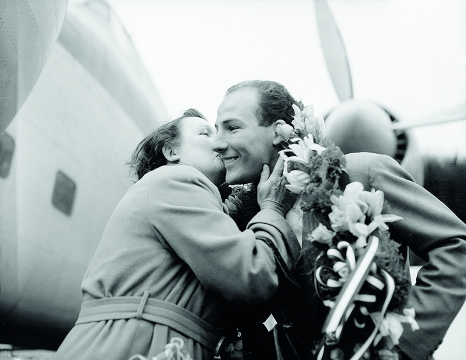 4th May 1955:  A victorious Stirling Moss is welcomed home by his mother.  (Photo by Walter Bellamy/Express/Getty Images)