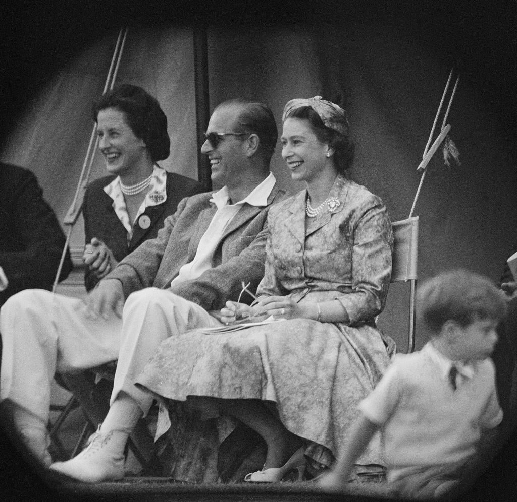 Queen Elizabeth II and Prince Philip, Duke of Edinburgh watch a cricket match at Highclere Castle, Highclere, Hampshire, 3rd August 1958.  (Photo by Victor Blackman/Daily Express/Hulton Archive/Getty Images)