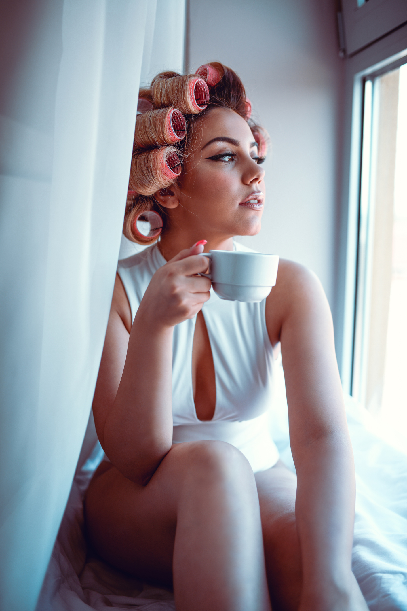 Cute Female With Hair Rolling Pins Drinking Coffee