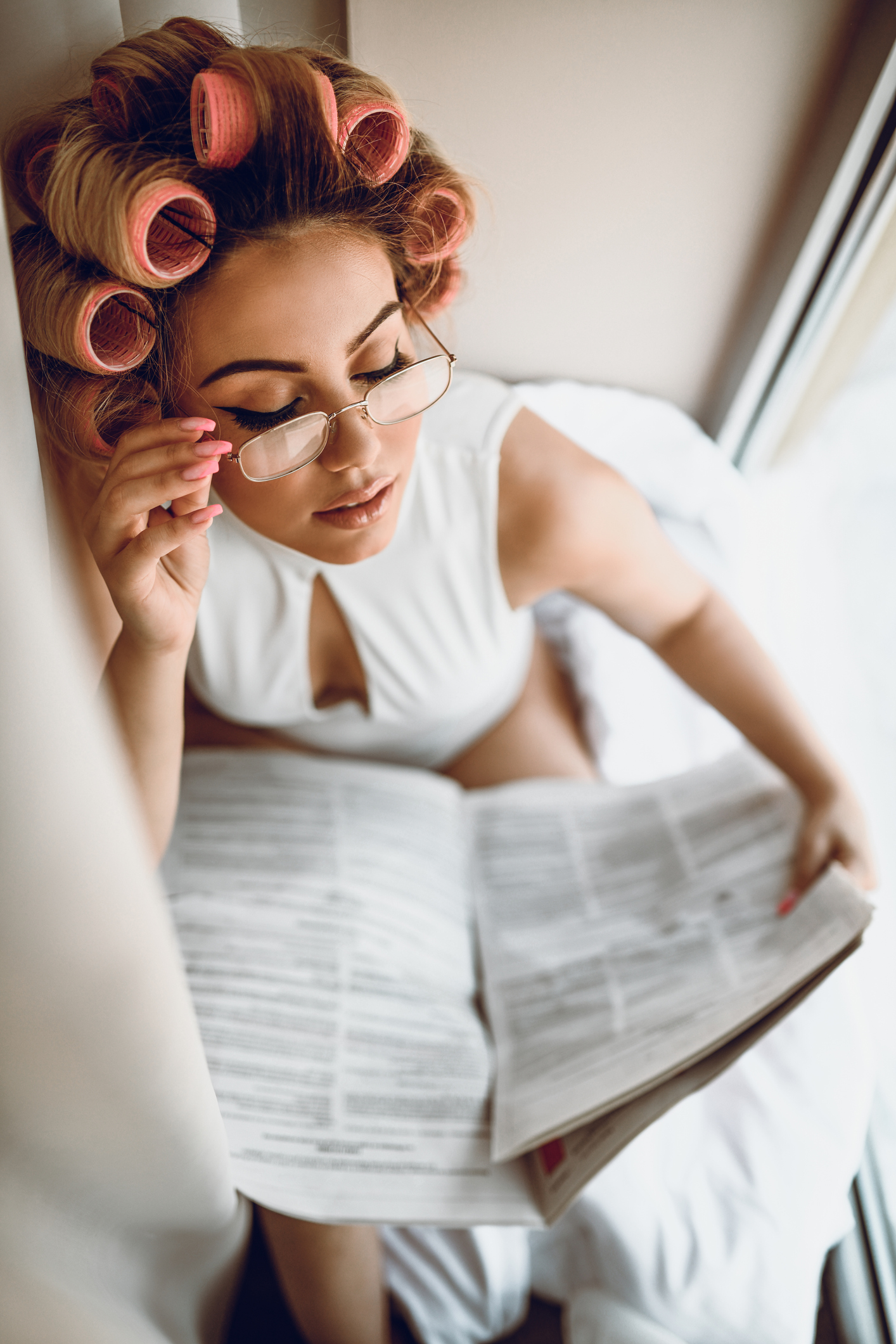 Reading Newspaper Is Morning Routine For Pin Up Girl
