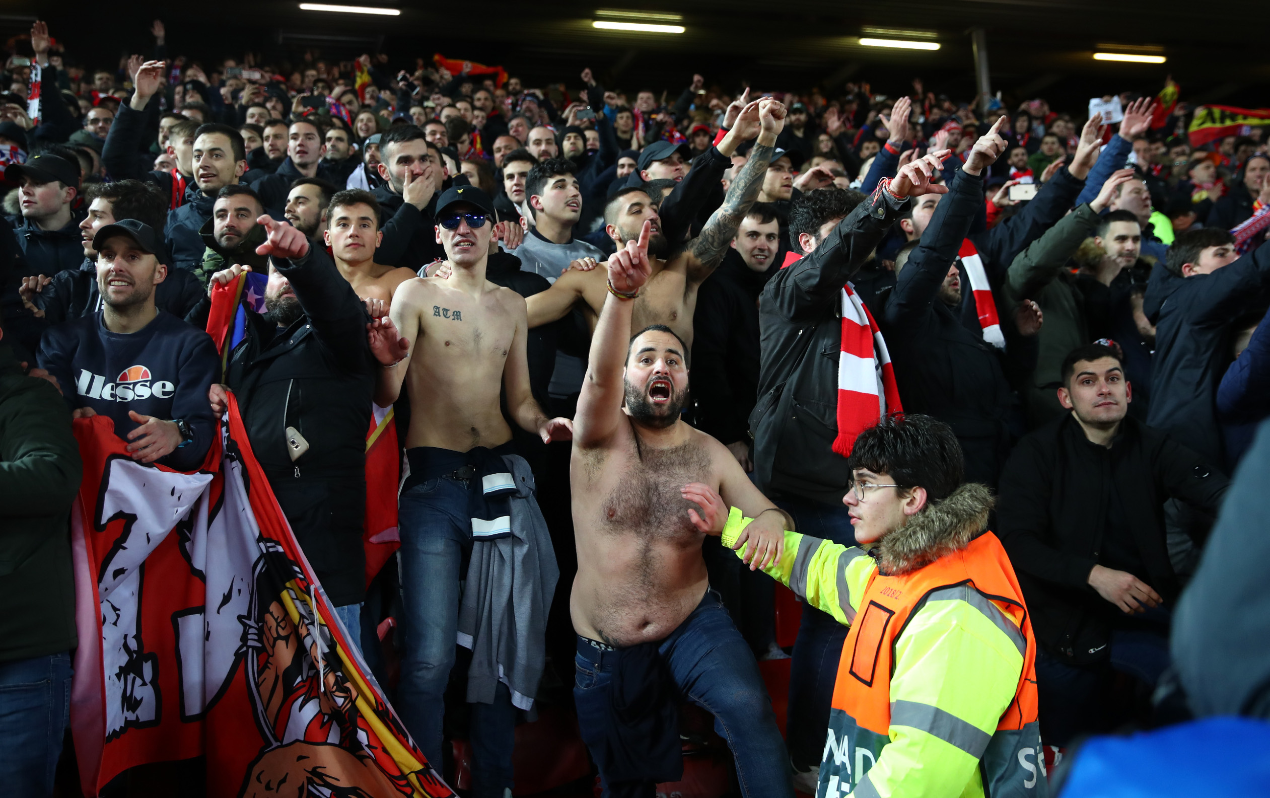 LIVERPOOL, ENGLAND - MARCH 11: Atletico Madrid fans celebrate victory after the UEFA Champions League round of 16 second leg match between Liverpool FC and Atletico Madrid at Anfield on March 11, 2020 in Liverpool, United Kingdom.  (Photo by Julian Finney/Getty Images)