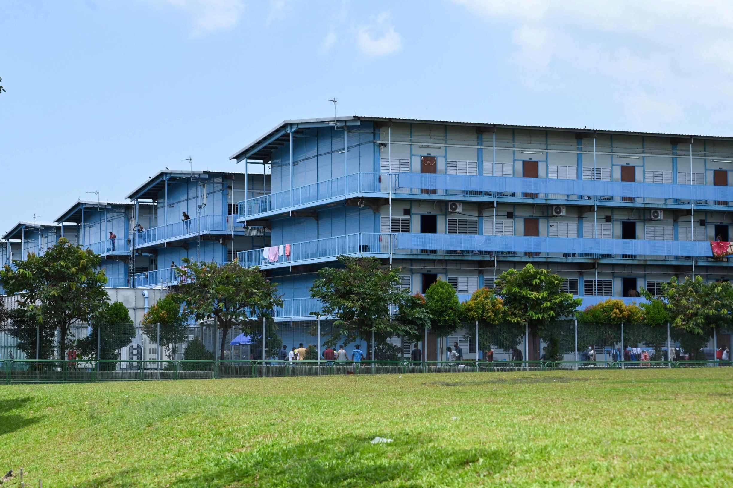 A general view shows the Tuas South foreign workers dormitory that has been placed under government restriction as preventive measure against the spread of the COVID-19 coronavirus in Singapore on April 19, 2020. - Singapore imposed a mandatory stay-home order for migrant workers including in the construction sector for 14 days effective on April 20 due to coronavirus pandemic. (Photo by Roslan RAHMAN / AFP)