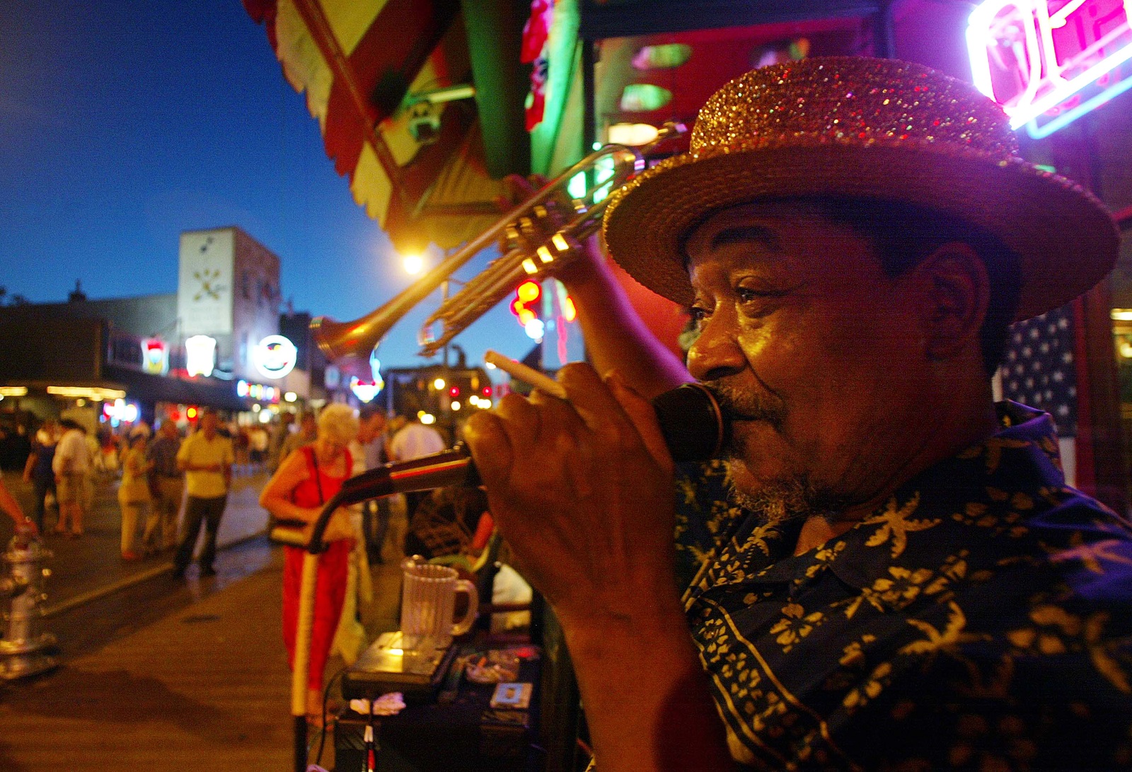 MEMPHIS - AUGUST 17:  A street performer sings on Beale Street during Elvis Week August 17, 2002 in Memphis, Tennessee. Up to 75,000 fans were expected to attend Memphis' Elvis Week which this year marks the 25th anniversary of Presley's August 16, 1977 death.  (Photo by Mario Tama/Gettty Images)