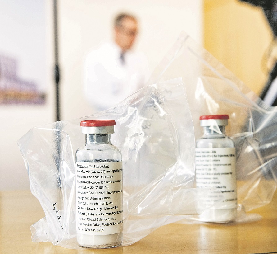 Vials of the drug Remdesivir lie during a press conference about the start of a study with the Ebola drug Remdesivir in particularly severely ill patients at the University Hospital Eppendorf (UKE) in Hamburg, northern Germany on April 8, 2020, amidst the new coronavirus COVID-19 pandemic. (Photo by Ulrich Perrey / POOL / AFP)