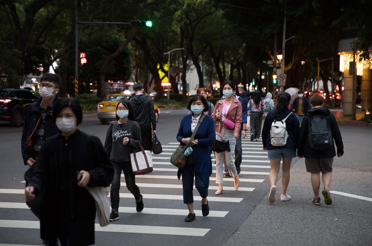 (200330) -- TAIPEI, March 30, 2020 () -- People wearing masks walk on street in Taipei, southeast China's Taiwan, March 30, 2020. The total number of novel coronavirus disease (COVID-19) cases in Taiwan has increased by eight to 306, the island's epidemic monitoring agency said Monday., Image: 510785527, License: Rights-managed, Restrictions: WORLD RIGHTS excluding China - Fee Payable Upon Reproduction - For queries contact Avalon.red - sales@avalon.red London: +44 (0) 20 7421 6000 Los Angeles: +1 (310) 822 0419 Berlin: +49 (0) 30 76 212 251, Model Release: no, Credit line: Jin Liwang / Avalon Editorial / Profimedia