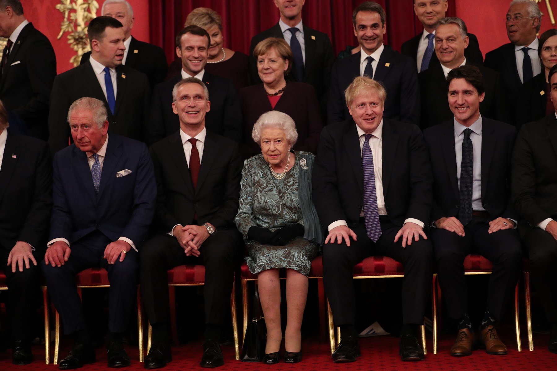 LONDON, ENGLAND - DECEMBER 03: Prince Charles, Prince of Wales, Jens Stoltenberg, Nato Secretary General, Queen Elizabeth II, Boris Johnson, Prime Minister of the United Kingdom and Justin Trudeau, Prime Minister of Canada join other Nato leaders for a group photograph at a reception for NATO leaders hosted by Queen Elizabeth II at Buckingham Palace on December 3, 2019 in London, England. Her Majesty Queen Elizabeth II hosted the reception at Buckingham Palace for NATO Leaders to mark 70 years of the NATO Alliance. (Photo by Yui Mok - WPA Pool/Getty Images)