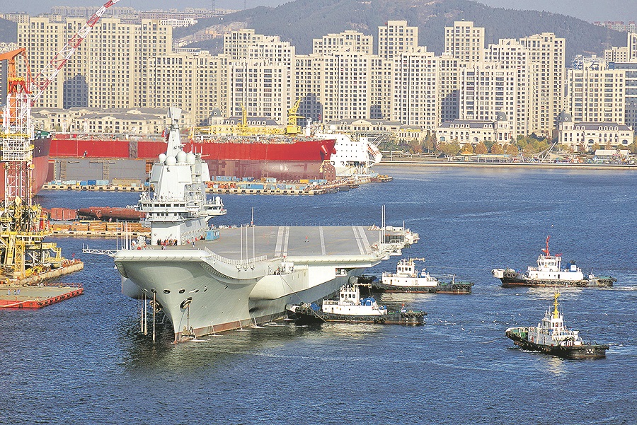 China's first domestically built aircraft carrier, the Type 001A, arrives at the shipyard of Dalian Shipbuilding Industry Co., Ltd. after completing the third sea trial in Dalian city, northeast China's Liaoning province, 6 November 2018.