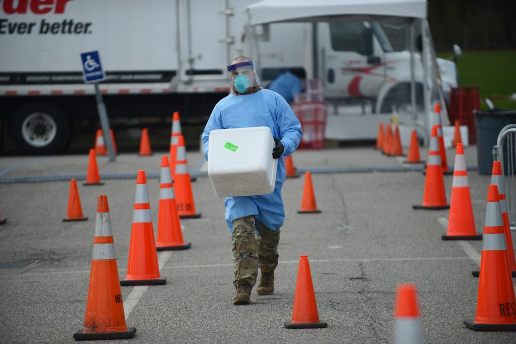 Medical professionals from the NYC Joint Task Force consisting of Army, Navy, Air Force and Marine Corps personnel administer COVID-19 tests at the drive-through COVID-19 testing center and field ER at Stony Brook, New York. The facility is scheduled to test 979 suspected coronavirus victims today, on April 4, 2020. (Photo by B.A. Van Sise/NurPhoto)
