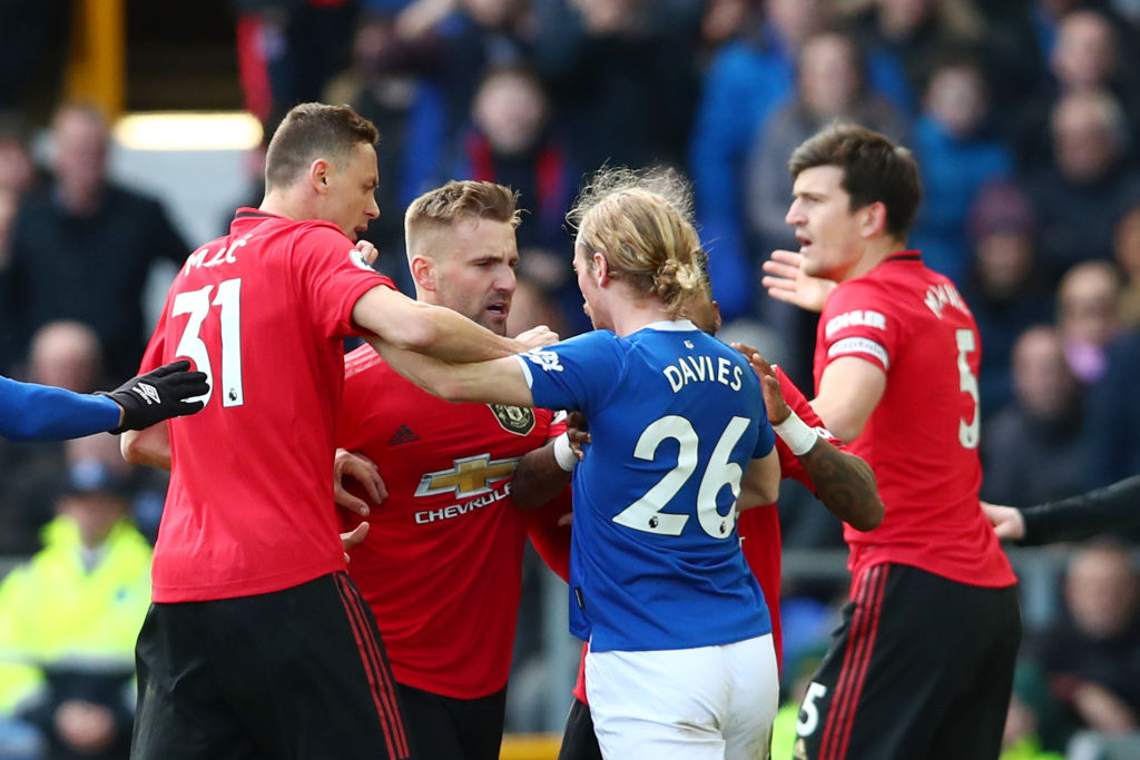 LIVERPOOL, ENGLAND - MARCH 01:  Luke Shaw of Manchester United has a heated exchange with Tom Davies of Everton during the Premier League match between Everton FC and Manchester United at Goodison Park on March 01, 2020 in Liverpool, United Kingdom. (Photo by Clive Brunskill/Getty Images)