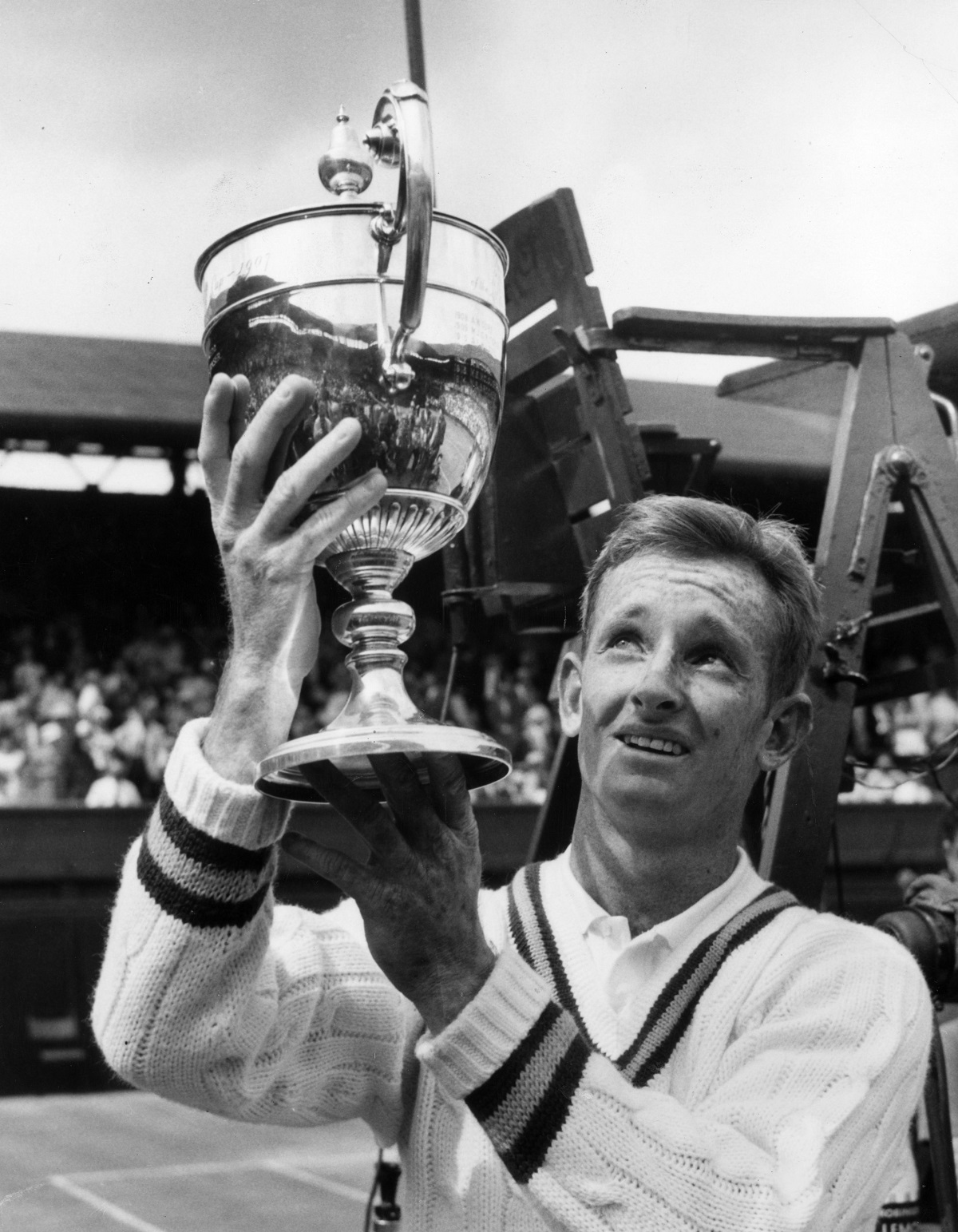 7th July 1961:  Australian tennis player Rod Laver proudly holding the Men's Singles Trophy at Wimbledon, after defeating Chuck McKinley.  (Photo by Douglas Miller/Keystone/Getty Images)